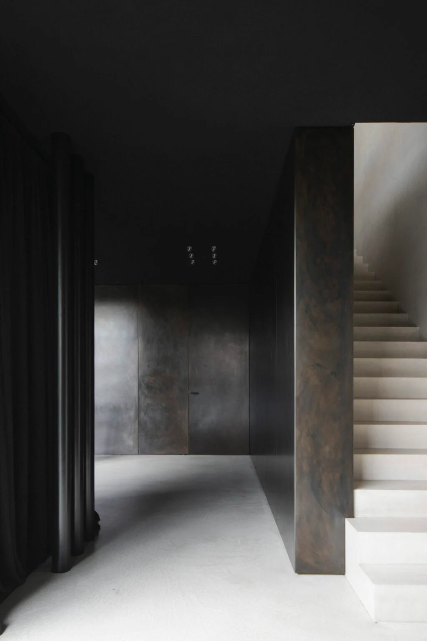 Villa Mahler by Anna Philipp + Eichkorn — A corridor perspective reveals the architectural vocabulary of Villa Mahler through materiality and spatial compression.