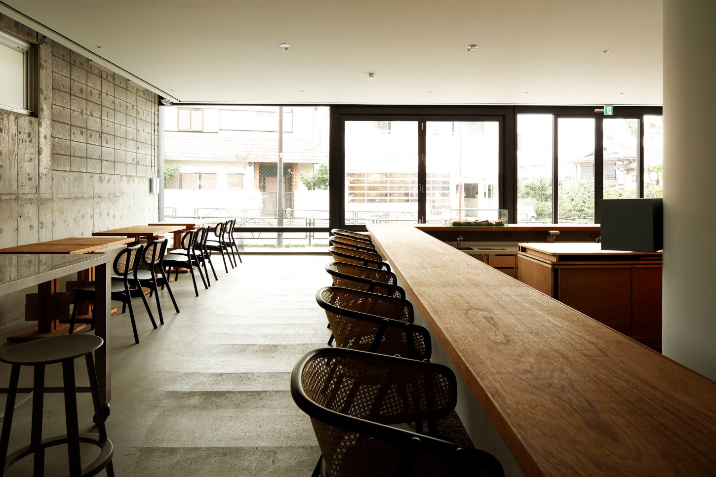 OGAWA COFFEE LABORATORY by Yusuke Seki Studio — The OGAWA Coffee Laboratory's interior unfolds as a linear sequence of functional zones along a timber counter.