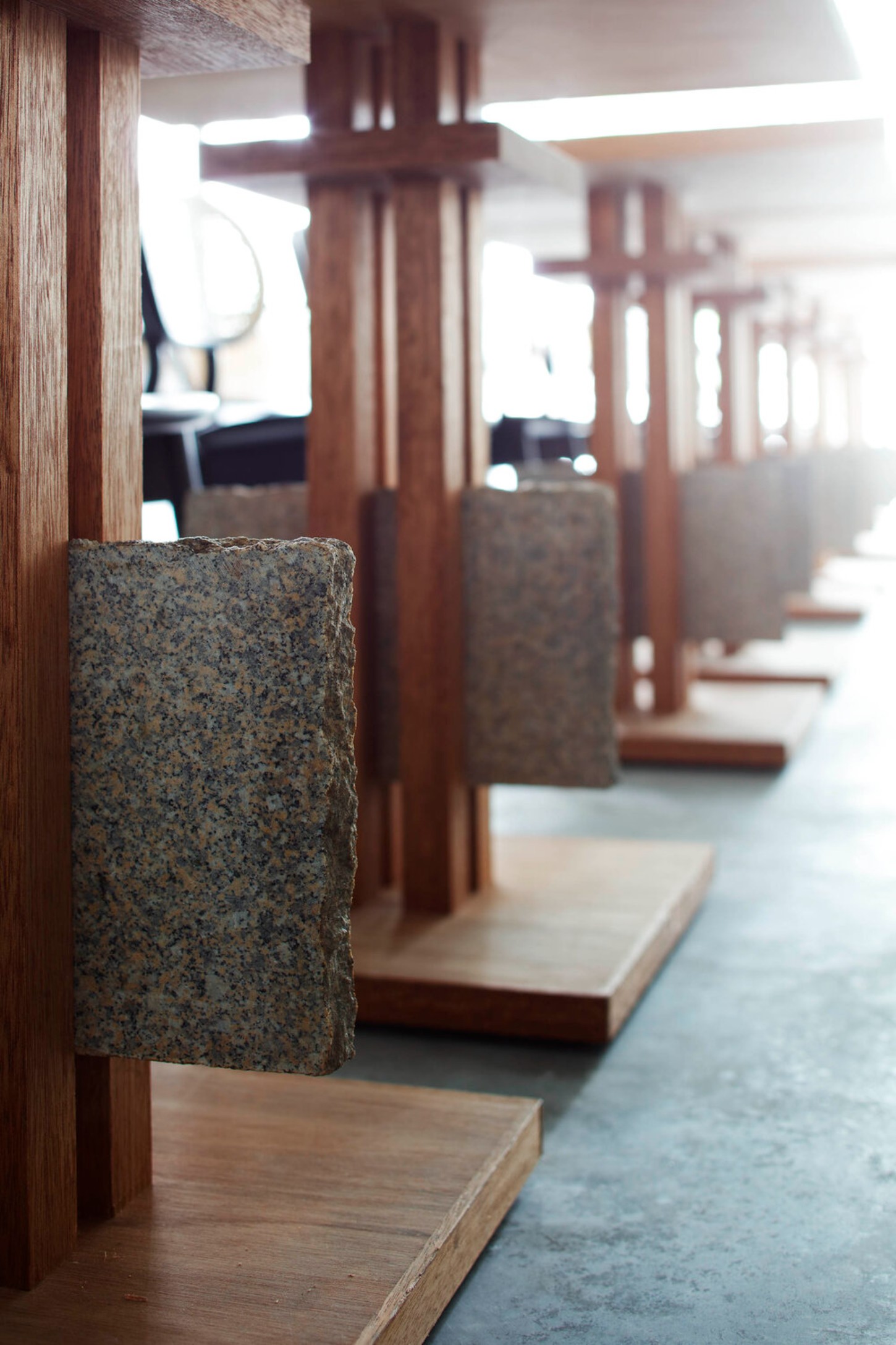 OGAWA COFFEE LABORATORY by Yusuke Seki Studio — A perspective view down the coffee preparation counter reveals the systematic material hierarchy of Ogawa Coffee Laboratory.