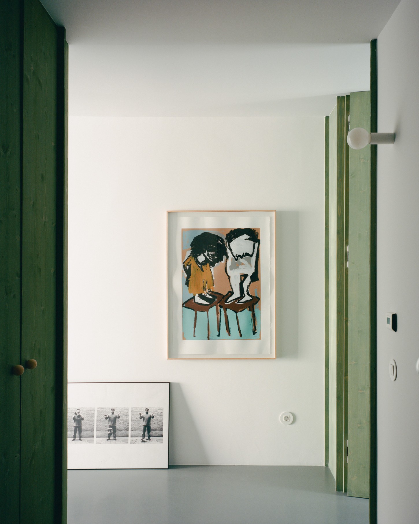 Marvilla House by Atelier José Andrade Rocha — A narrow green-framed passage reveals a studied interior composition.