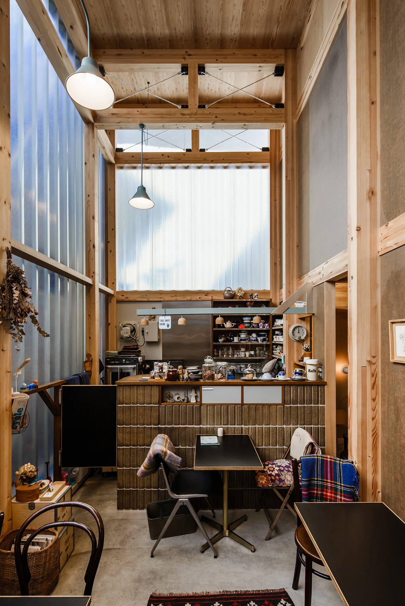 House A/Shop B (Bolts Hardware Store) by KimuraMatsumoto Architects — Interior view of the hardware store component revealing the dual-function spatial organization.
