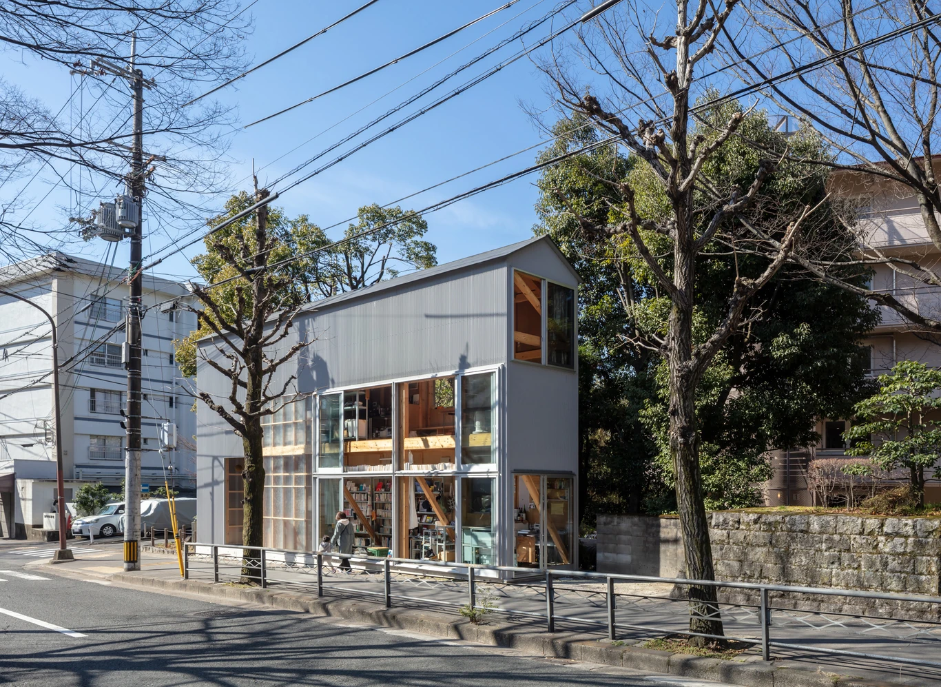 House S/Shop B (ba hütte) by KimuraMatsumoto Architects — A two-story mixed-use structure clad in corrugated metal siding positioned flush against a Kyoto street frontage.