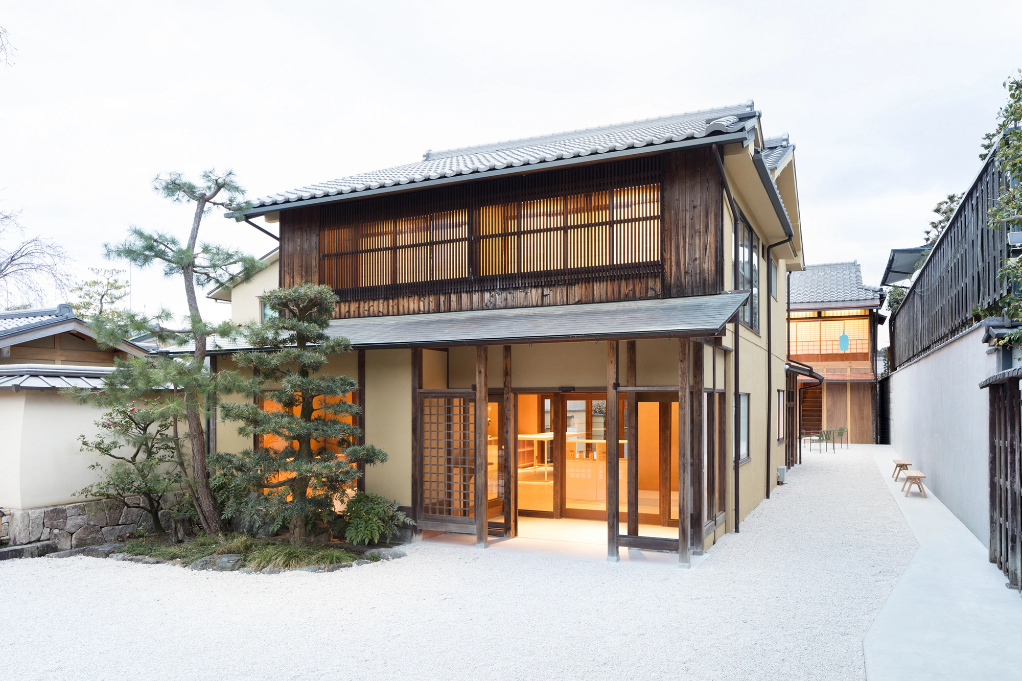 Blue Bottle Coffee Kyoto Cafe by Schemata Architects — The Blue Bottle Coffee Kyoto café presents a hybrid threshold space where traditional Japanese architectural grammar meets contemporary minimalism.
