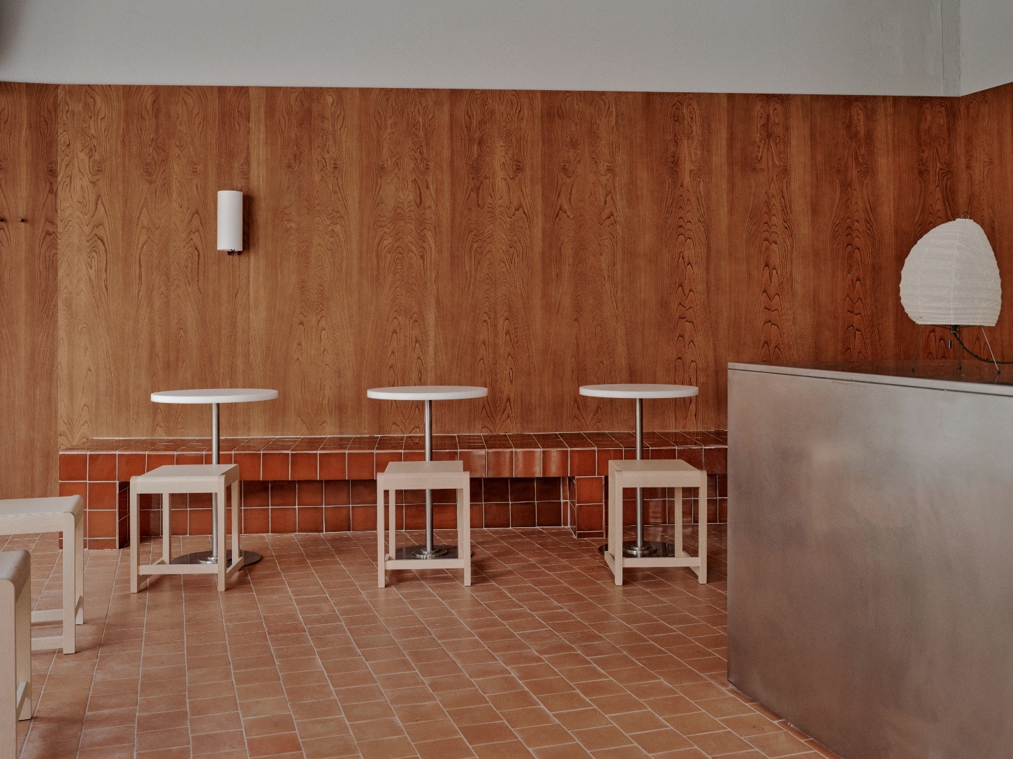 ACID Cafe by Plantea Studio by Plantea Estudio — The café's dining area demonstrates restrained minimalism through coordinated materiality.