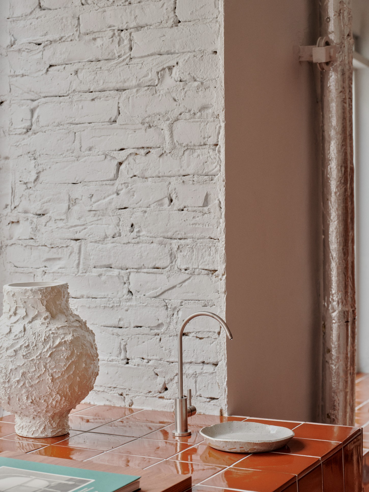 ACID Cafe by Plantea Studio by Plantea Estudio — A close-up detail of ACID Cafe's counter zone captures the intersection of material textures and functional minimalism.