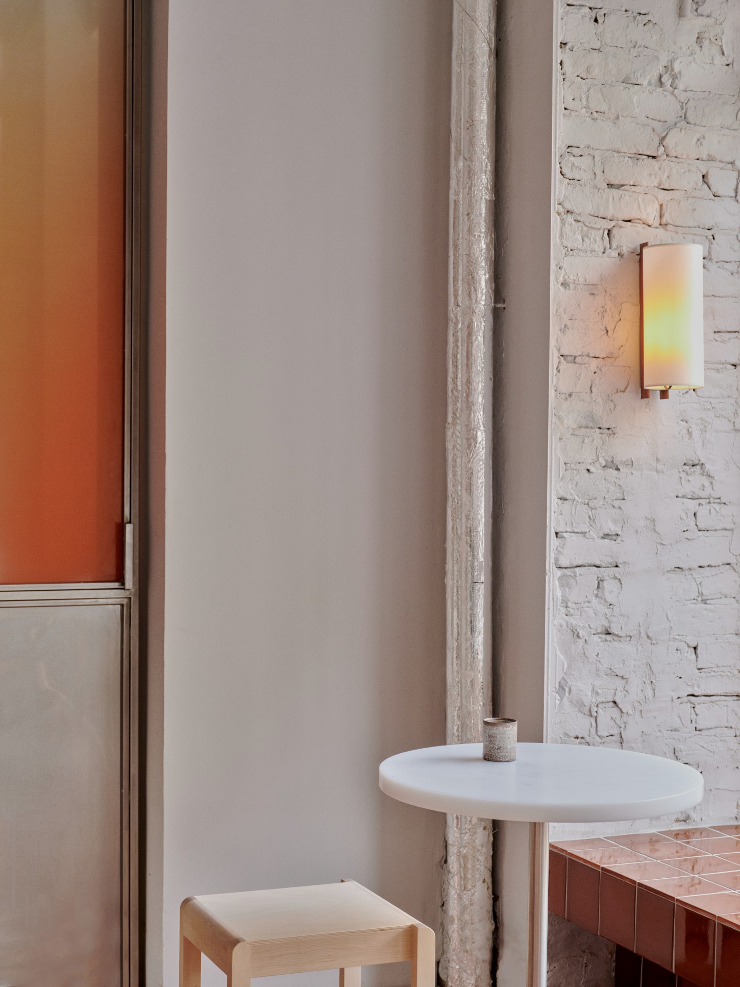 ACID Cafe by Plantea Studio by Plantea Estudio — A detail view of ACID Cafe's minimalist interior reveals the studied restraint of its design language.