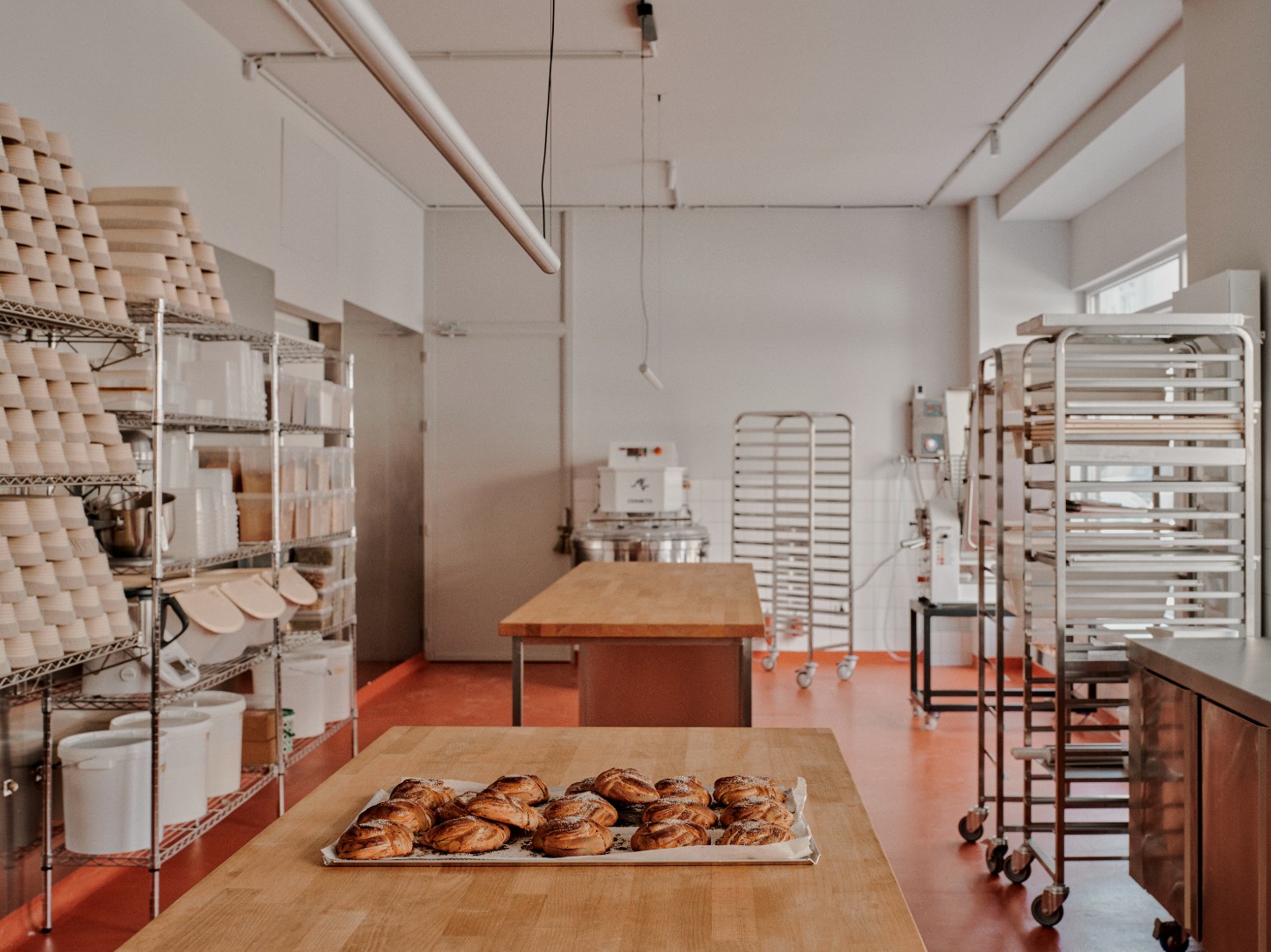 ACID Cafe by Plantea Studio by Plantea Estudio — ACID Cafe's production kitchen reveals a working patisserie in operation.
