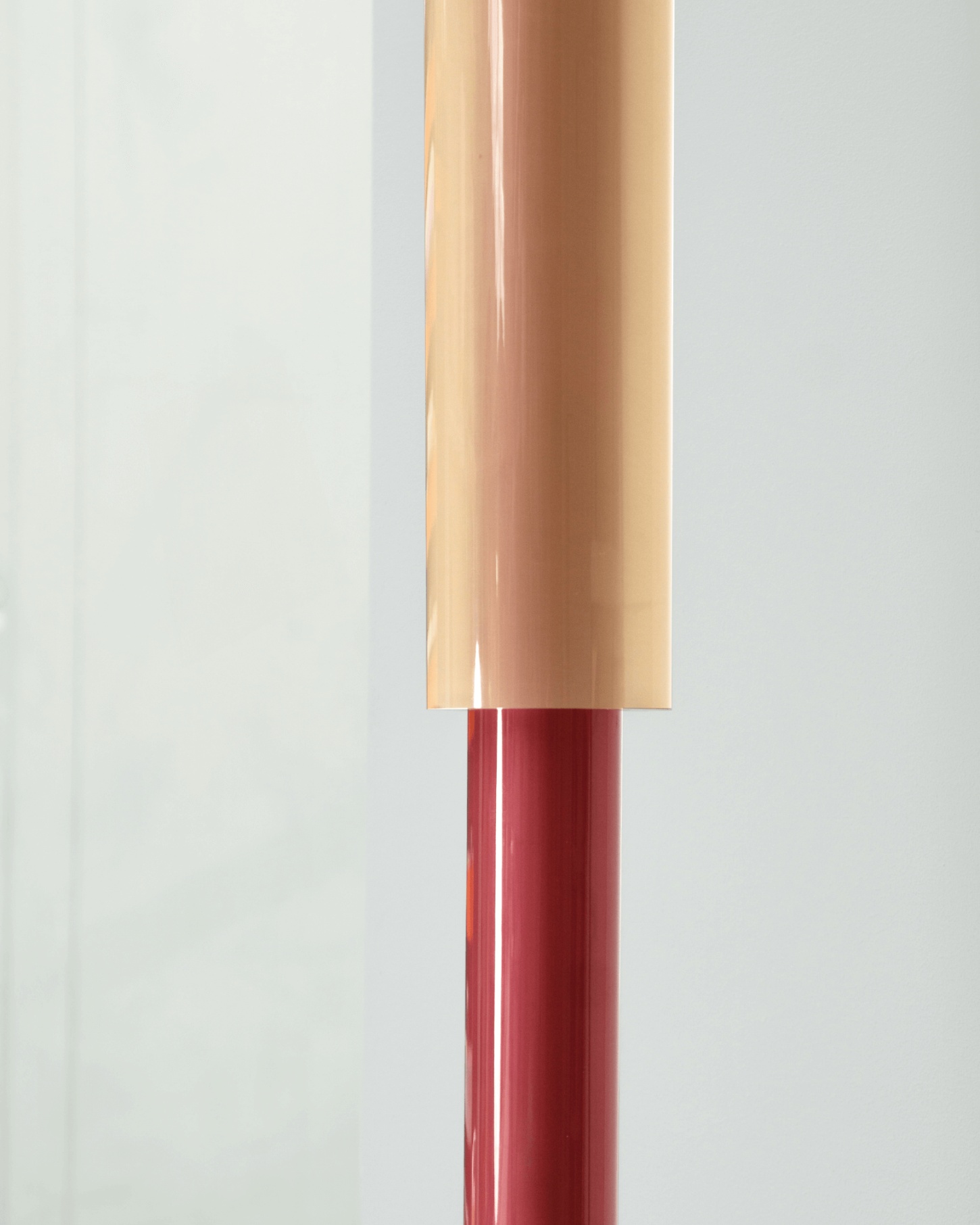 Selected Works by Forever Studio — A cylindrical vessel in deep burgundy transitions to a tapered rectangular form in warm cream and blush tones, creating a two-part composition with distinct...