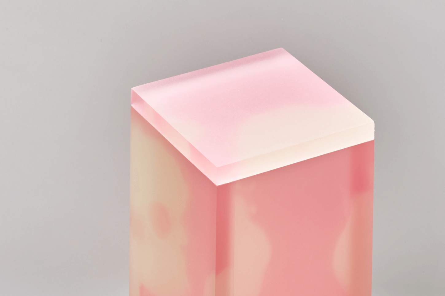 Selected Works by Forever Studio — A translucent resin or cast object in soft pink and cream tones, photographed against a neutral grey ground.