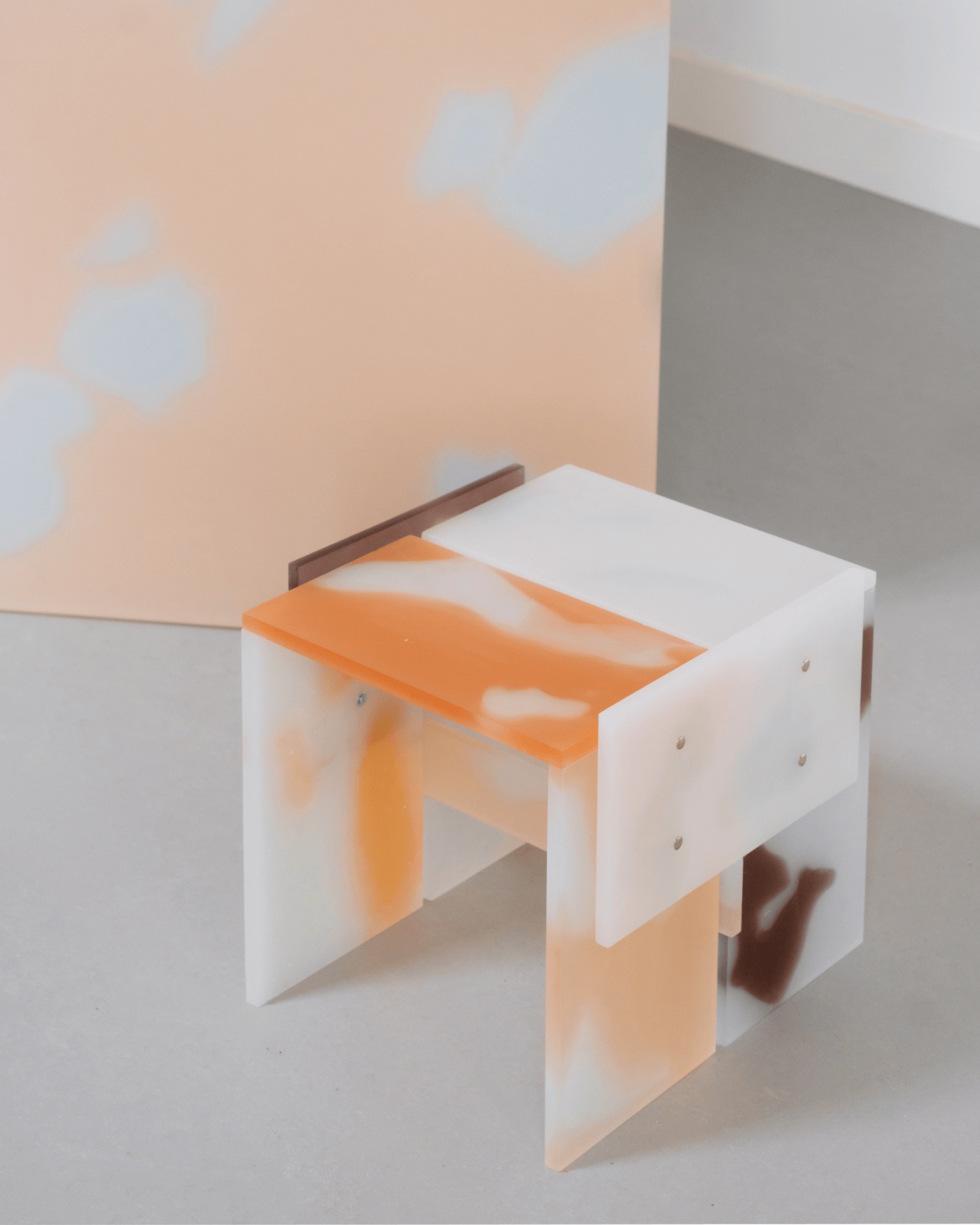 Selected Works by Forever Studio — A modular table or bench prototype combining white laminated panels with an orange-toned timber top and dark wooden crossbeam.