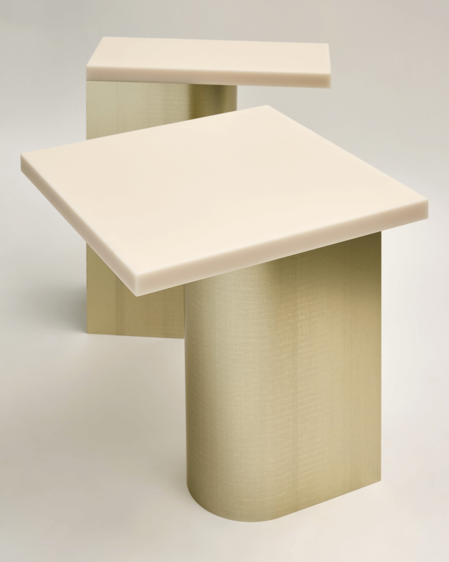 Selected Works by Forever Studio — A sculptural side table by Forever Studio featuring a cream-colored cast or molded top surface supported by a pale sage cylindrical pedestal base.