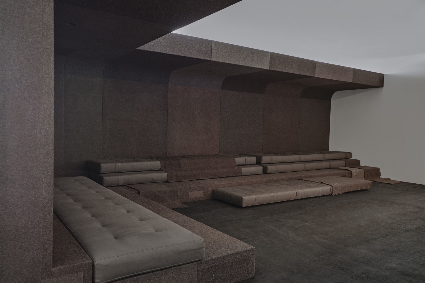 The Glade by Rick Owens — A recessed seating alcove demonstrates Owens' integration of sculptural architecture with functional furniture design.