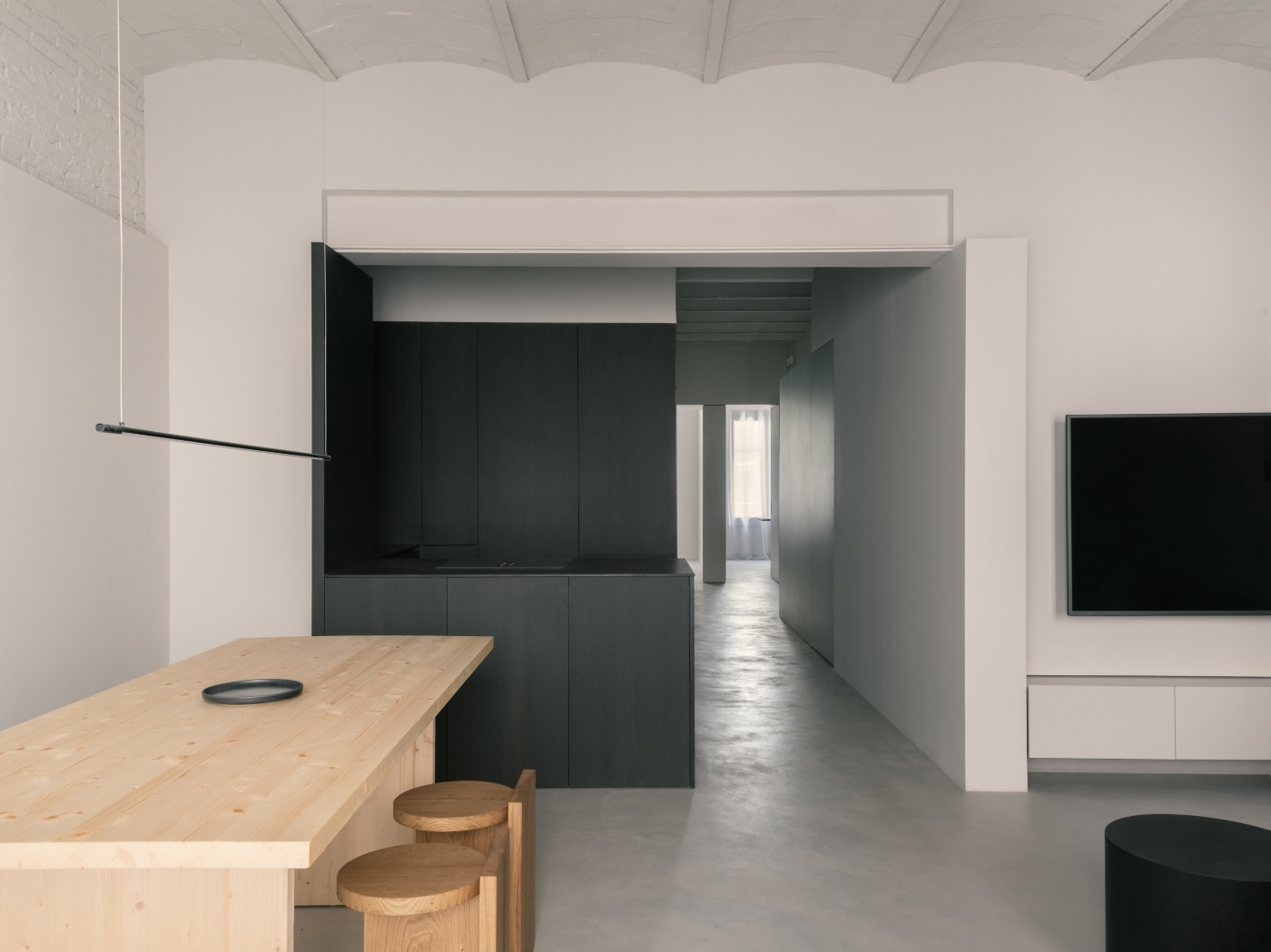 Casa Norte by CORREA Studio — Casa Norte's unified living space showcases a deliberate material dialogue through chromatic contrast.