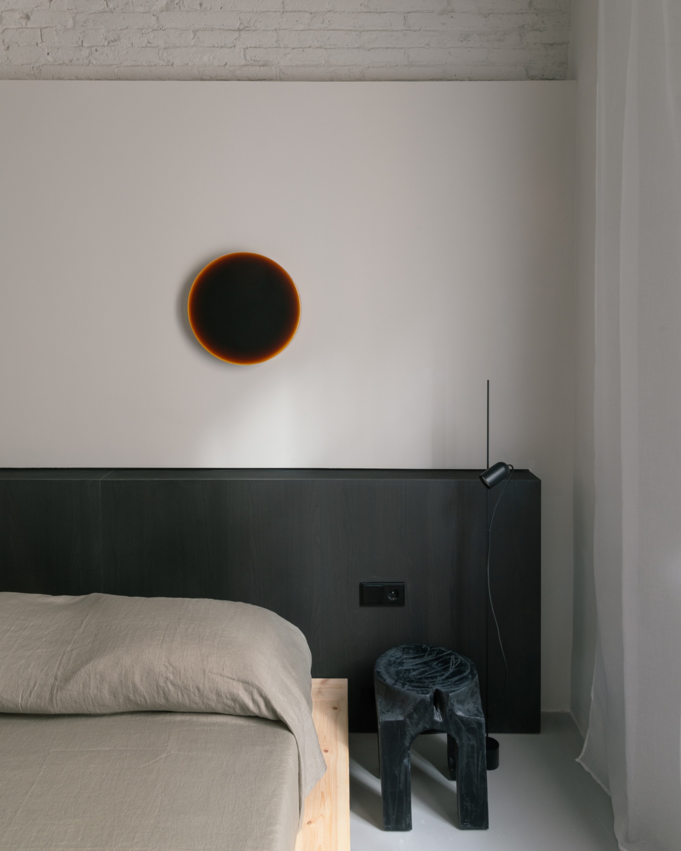Casa Norte by CORREA Studio — A minimalist bedroom corner frames a compositional study in chromatic contrast.