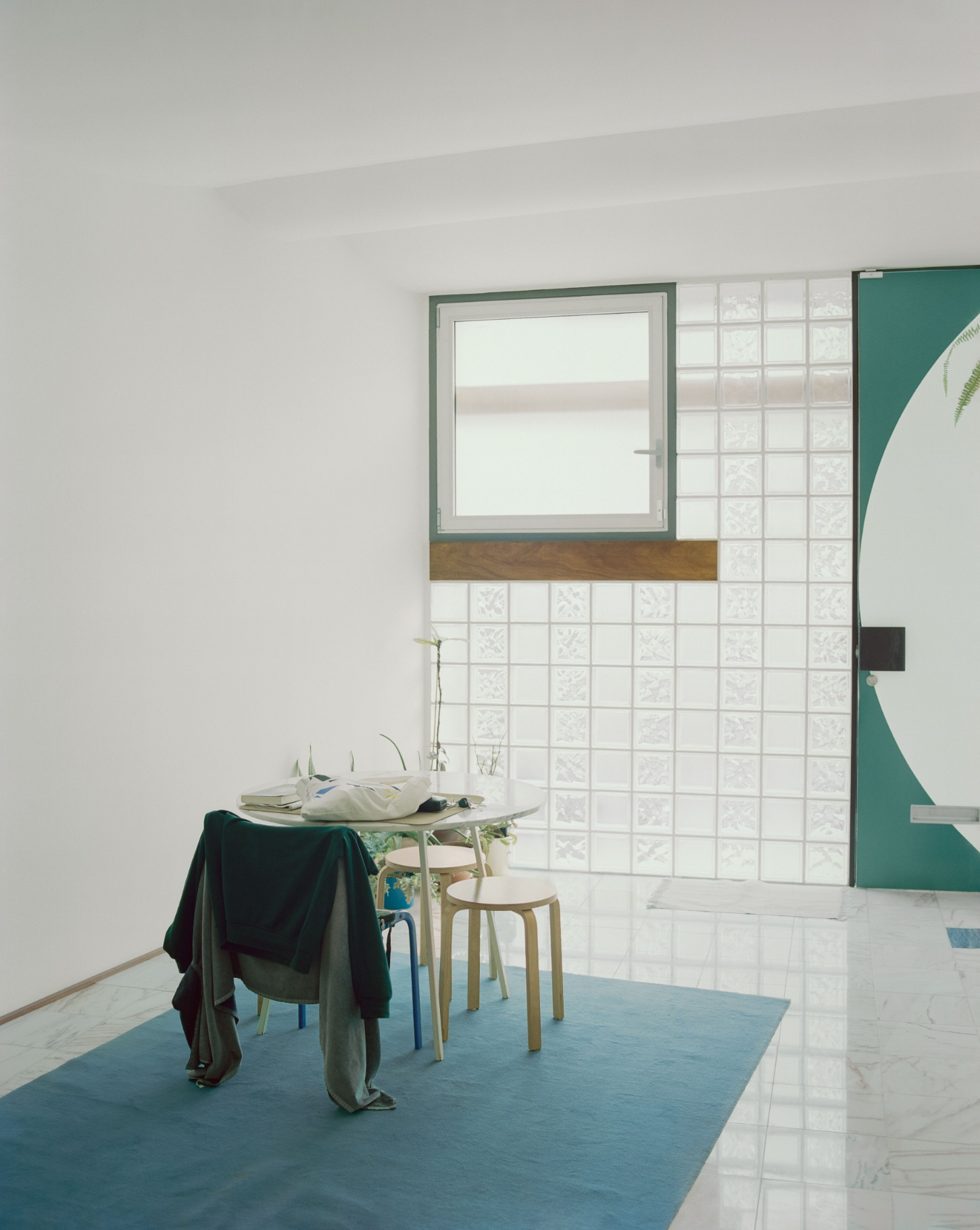 'Fireworks in White' by Willem Pab — A sparsely furnished interior defined by material contrast and chromatic restraint.