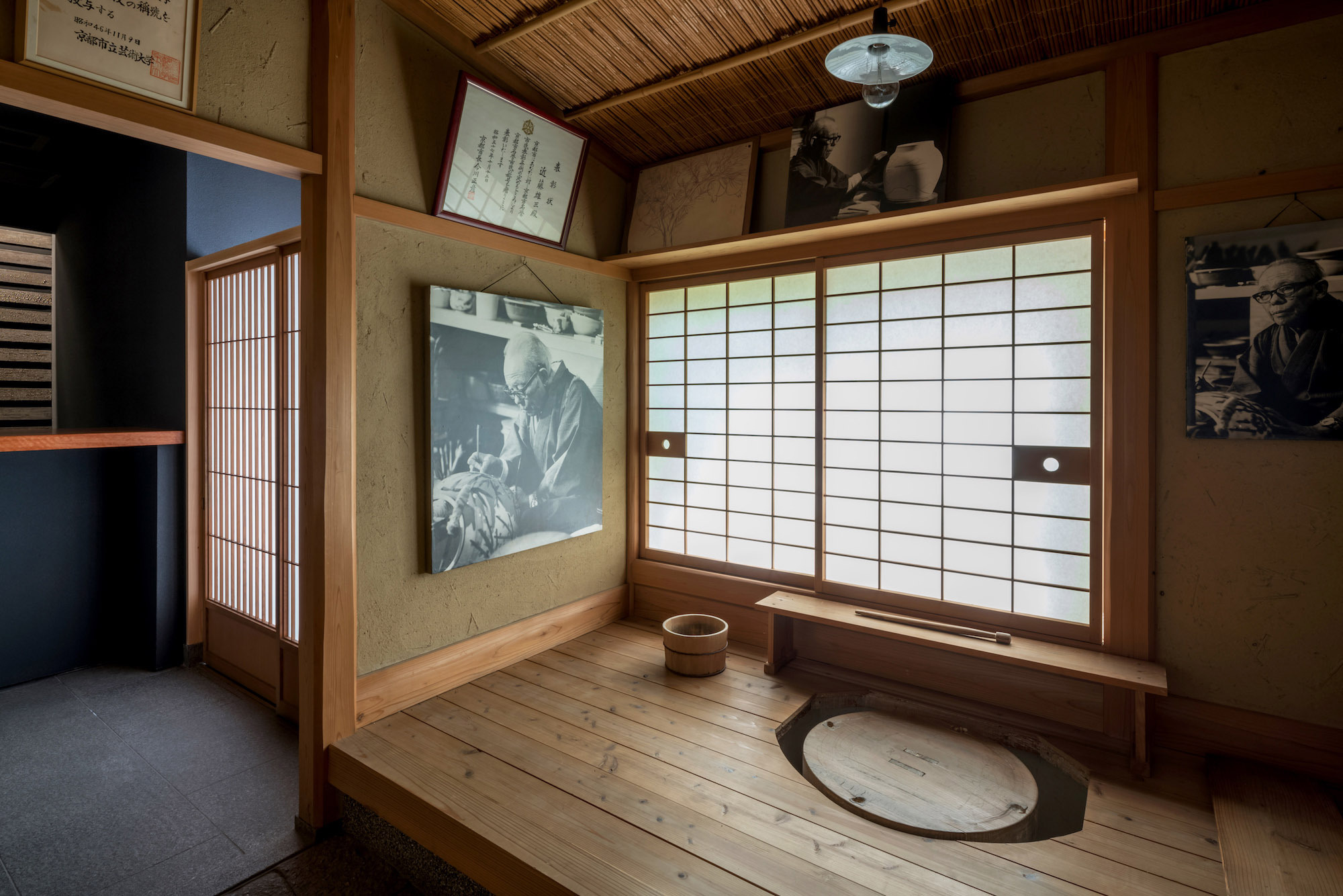 Kondo Museum in Kyoto by Mamiya Shinichi Design Studio — Interior view of a reconstructed traditional Japanese domestic space within the Kondo Museum, featuring post-and-beam timber construction with natural wood...