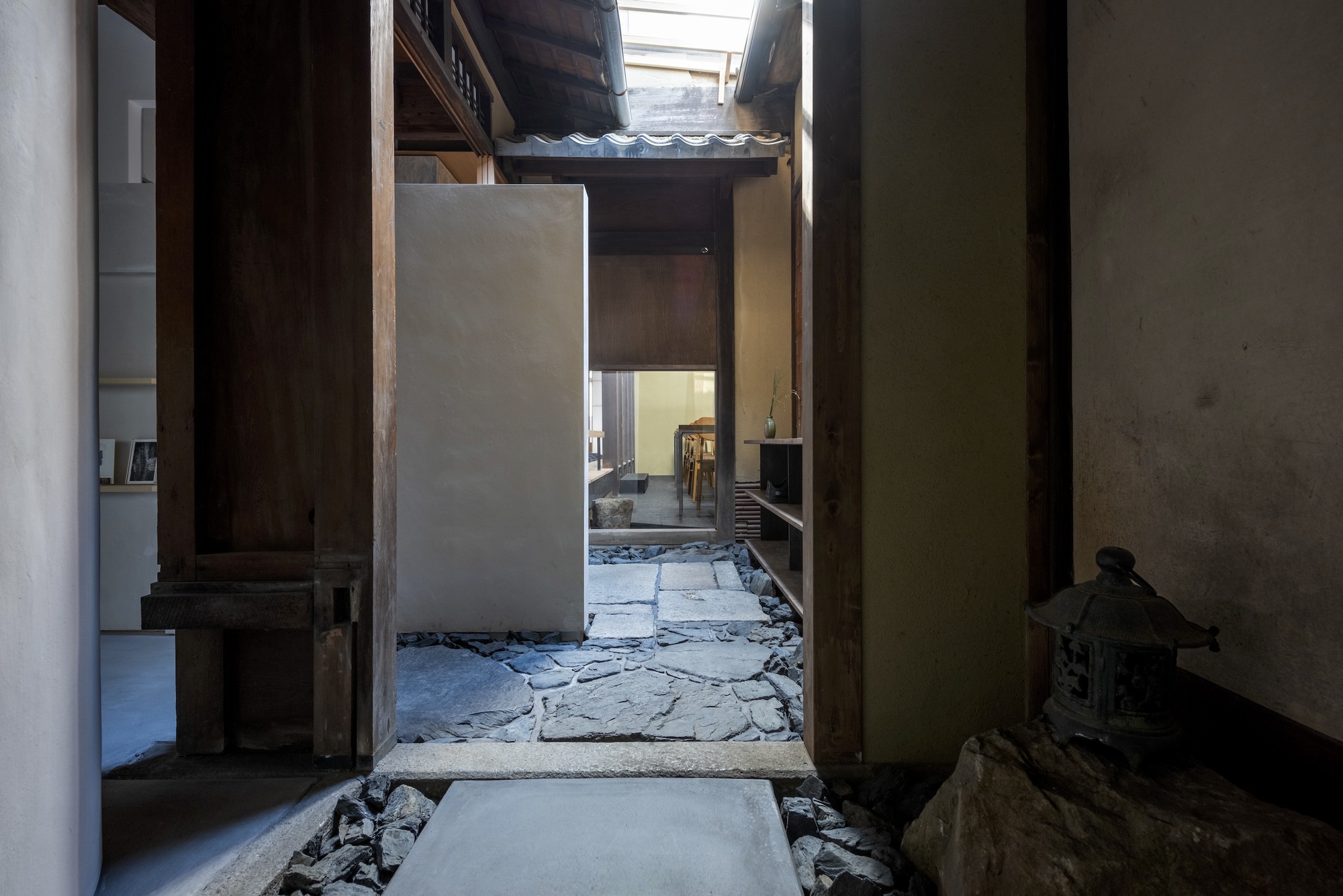 Kawamichiya Kosho-An Restaurant by td-Atelier + Endo Shorijo Design by td-Atelier and Endo Shorijo Design — A linear passage through the renovated townhouse reveals layered thresholds and material contrasts.