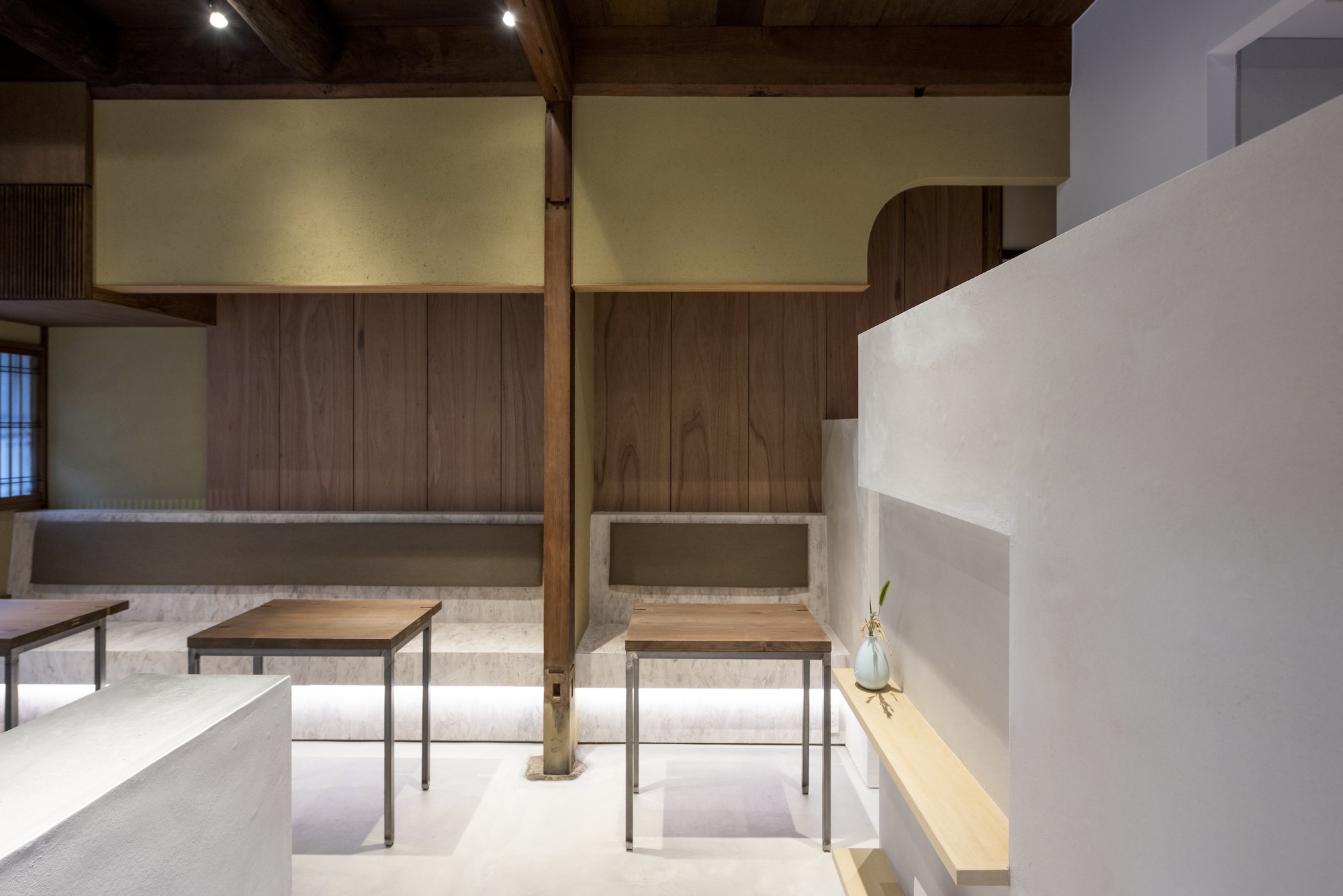 Kawamichiya Kosho-An Restaurant by td-Atelier + Endo Shorijo Design by td-Atelier and Endo Shorijo Design — Interior view of a multi-level restaurant space featuring exposed timber structural beams and whitewashed upper walls.
