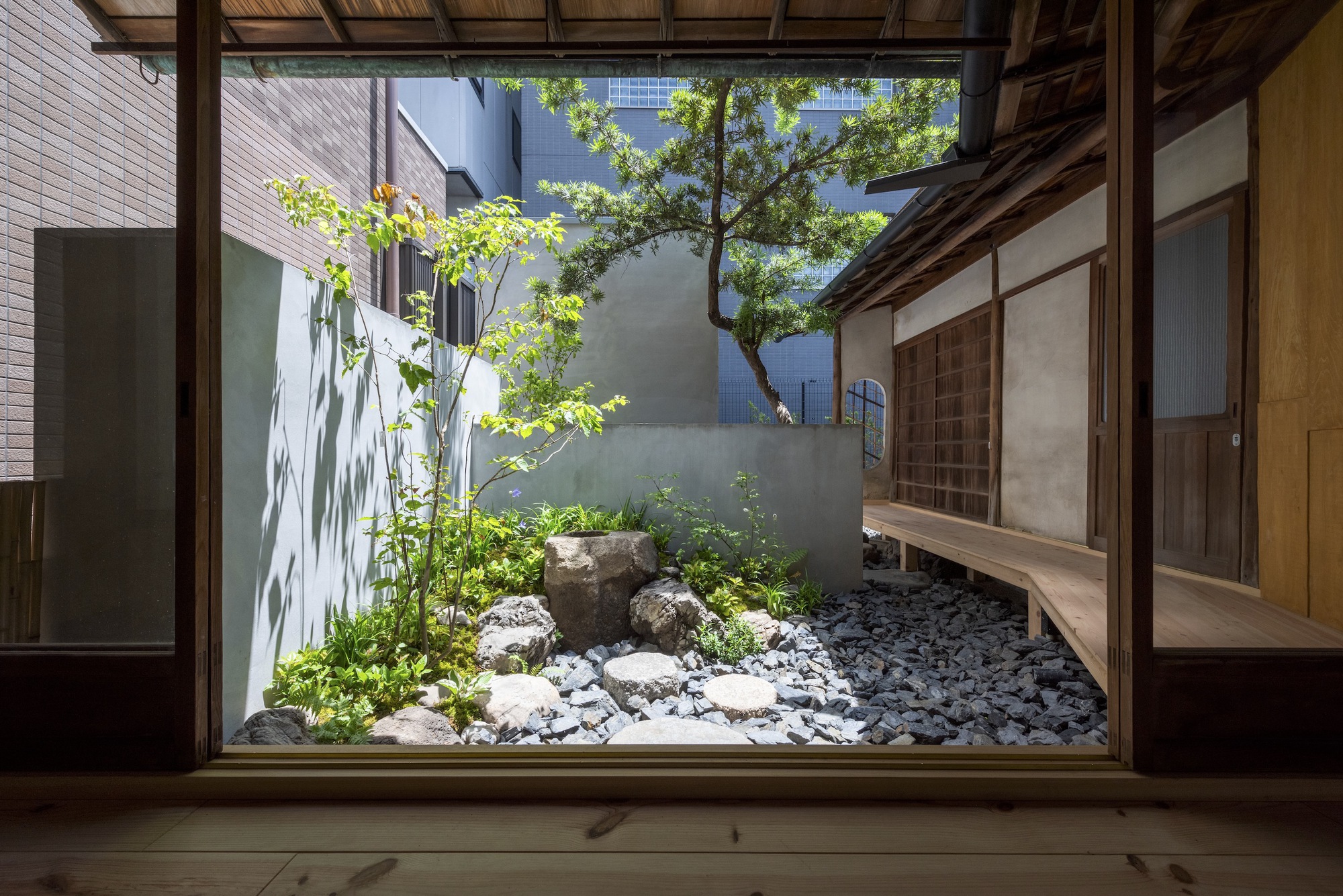 Kawamichiya Kosho-An Restaurant by td-Atelier + Endo Shorijo Design by td-Atelier and Endo Shorijo Design — A framed garden courtyard viewed through an expansive timber-mullioned window opening.