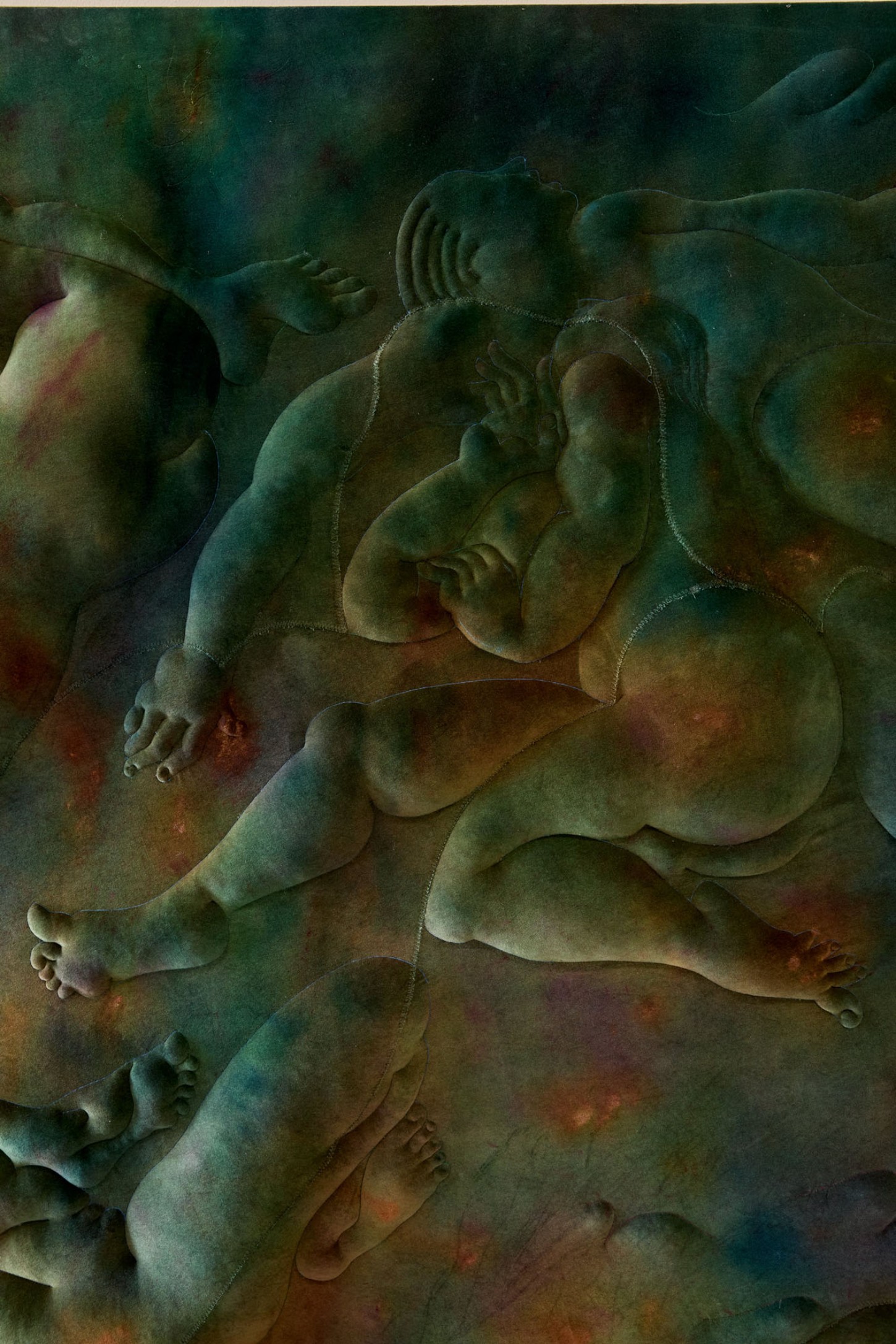 Thirst by Eliška Konečná at Polansky — Carved sandstone relief depicting overlapping nude figures in reclining and seated poses across a weathered surface.
