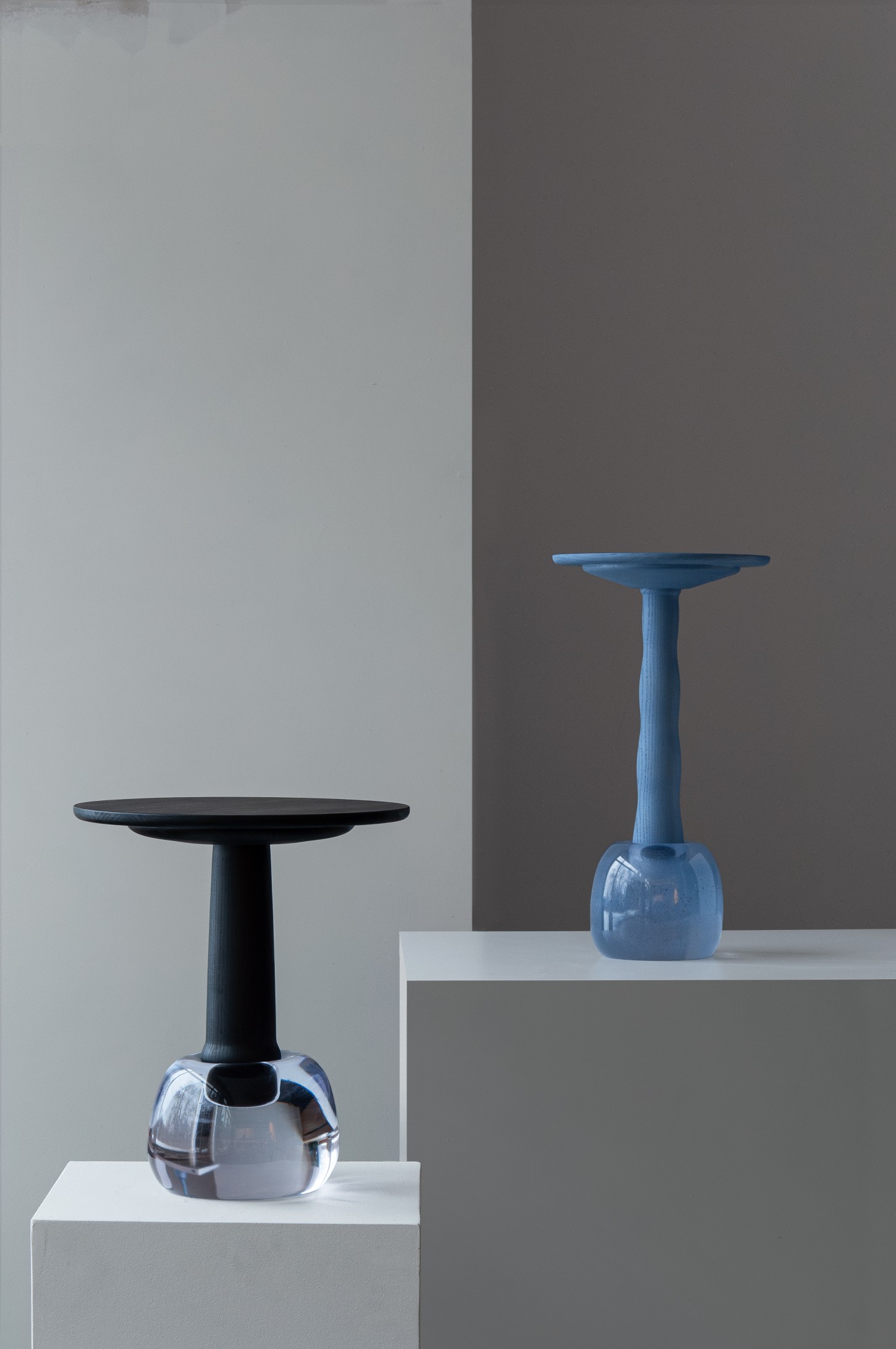 'Burn & Turn' by Adrian Bursell + Siri Svedborg — Two pedestal tables from 'Burn & Turn' demonstrate the collaborative studio's material contrasts and hand-craft sensibility.
