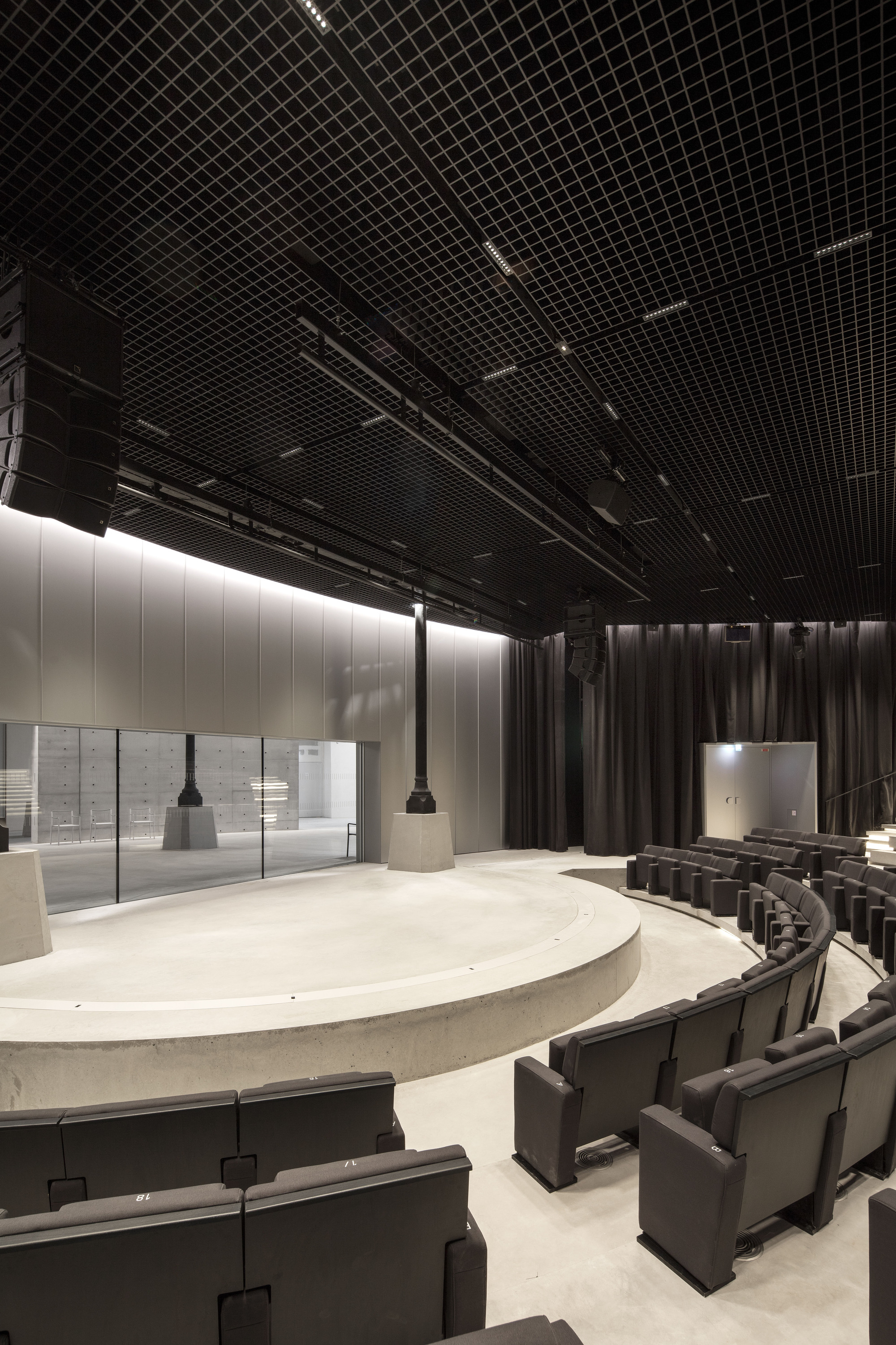 Paris' La Bourse de Commerce redesigned by Tadao Ando — The cylindrical concrete intervention dominates the rotunda's interior void, rising 9 meters as a monolithic sculptural form.