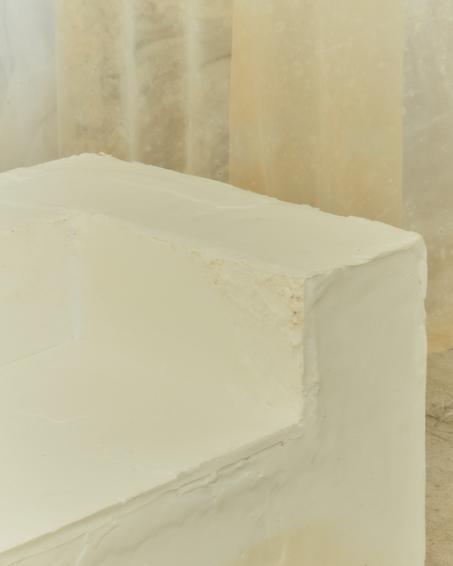 'White Utopia' by Natural Material Studio — A close-up detail of a sculptural basin crafted from Procel bioplastic, showcasing the material's smooth, seamless surface finish.
