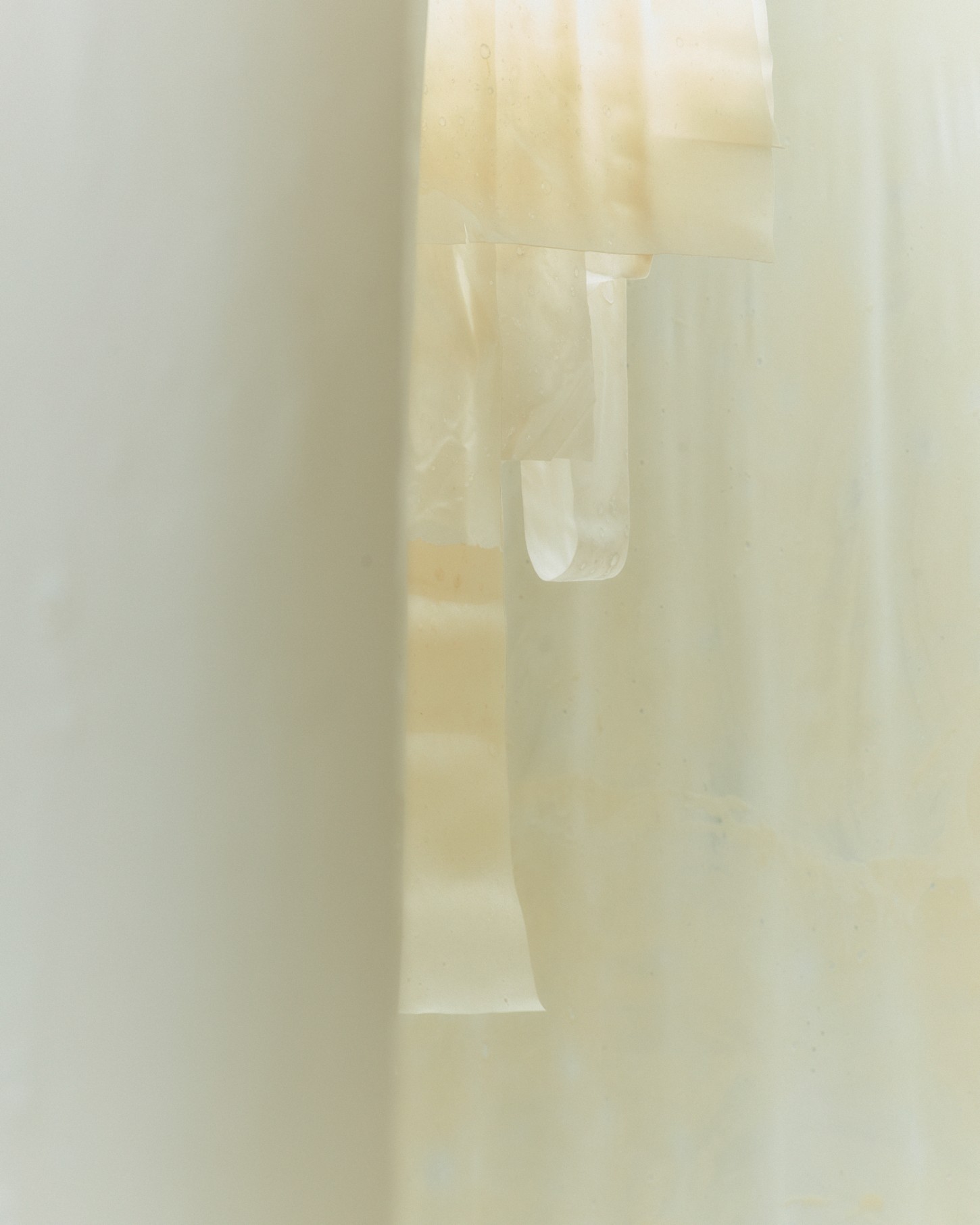 'White Utopia' by Natural Material Studio — A detail photograph of a bioplastic basin niche reveals the material's capacity for seamless molding and smooth surface finish.