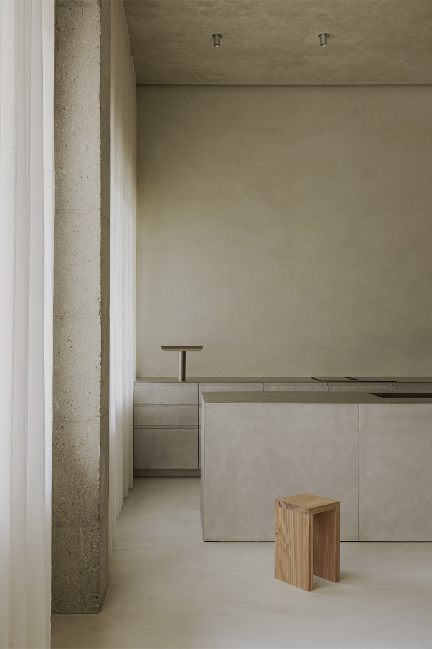 ZØ Residence by Studio Beta Ø — A minimalist interior passage defined by raw materiality and spatial clarity.
