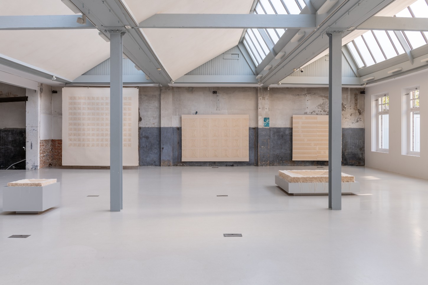'Repetition is a Form of Change' by Sophie Rowley at Looiersgracht 60 — Sophie Rowley's installation occupies a converted industrial gallery space with steel columns and skylit ceiling.