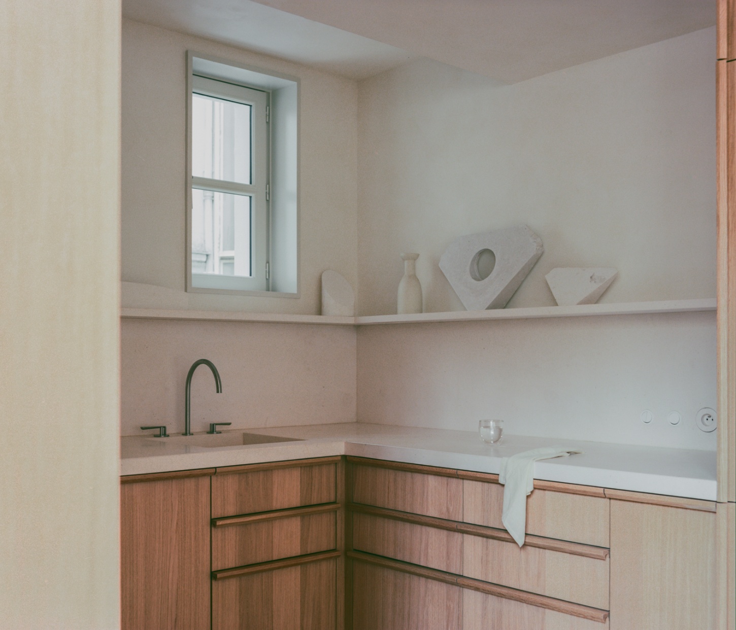 Casey Casey Showroom by Atelier NEA — A corner bathroom detail showcasing the showroom's material palette and functional minimalism.