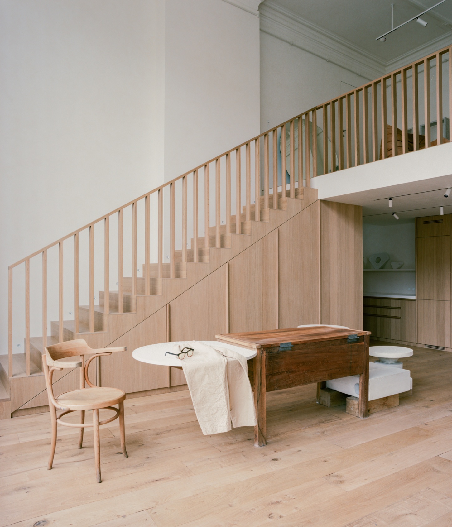 Casey Casey Showroom by Atelier NEA — The Casey Casey showroom interior pivots around a dual-purpose spatial arrangement.