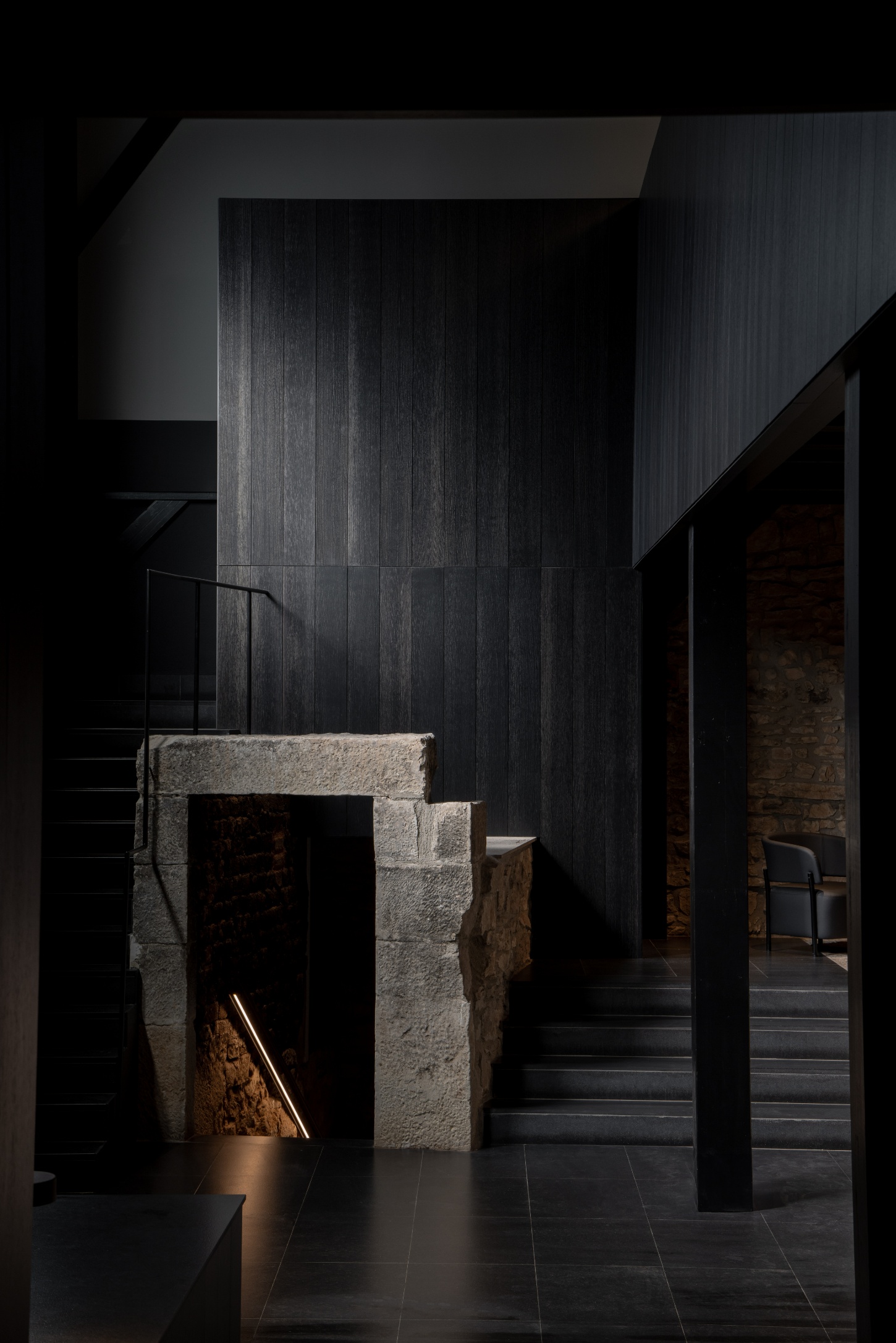 Tritium Winery by Francesc Rifé Studio — A passage through the Tritium Winery's interior reveals the architectural dialogue between old and new.