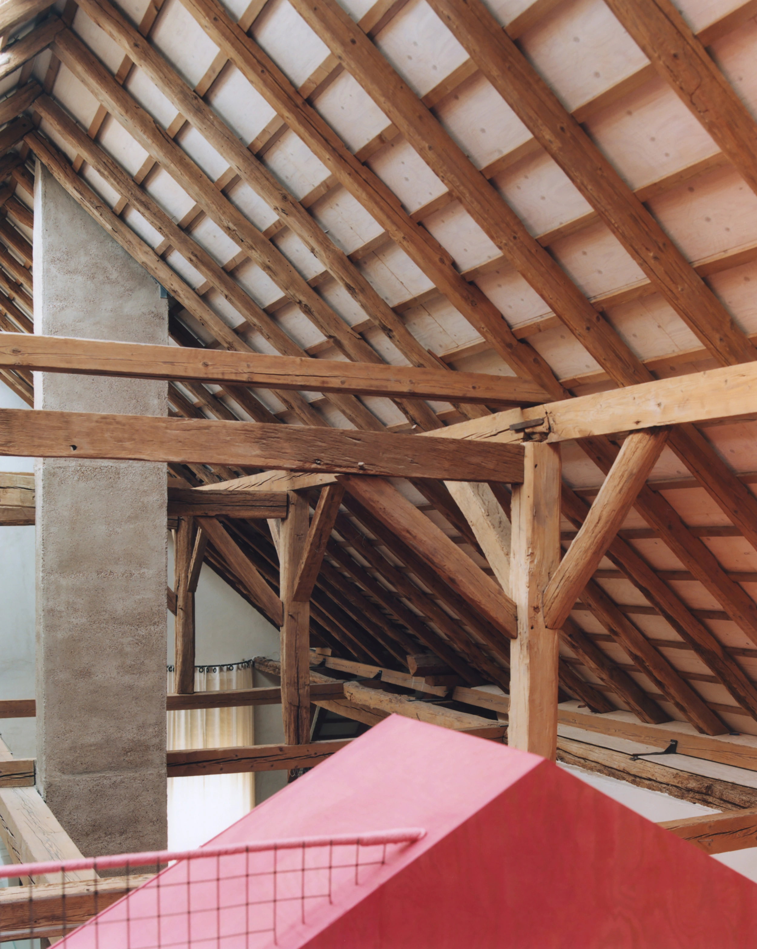 Erika and Willi's Barn by Piertzovanis Toews — A section of the renovated mill interior reveals the layered approach to preservation and intervention.