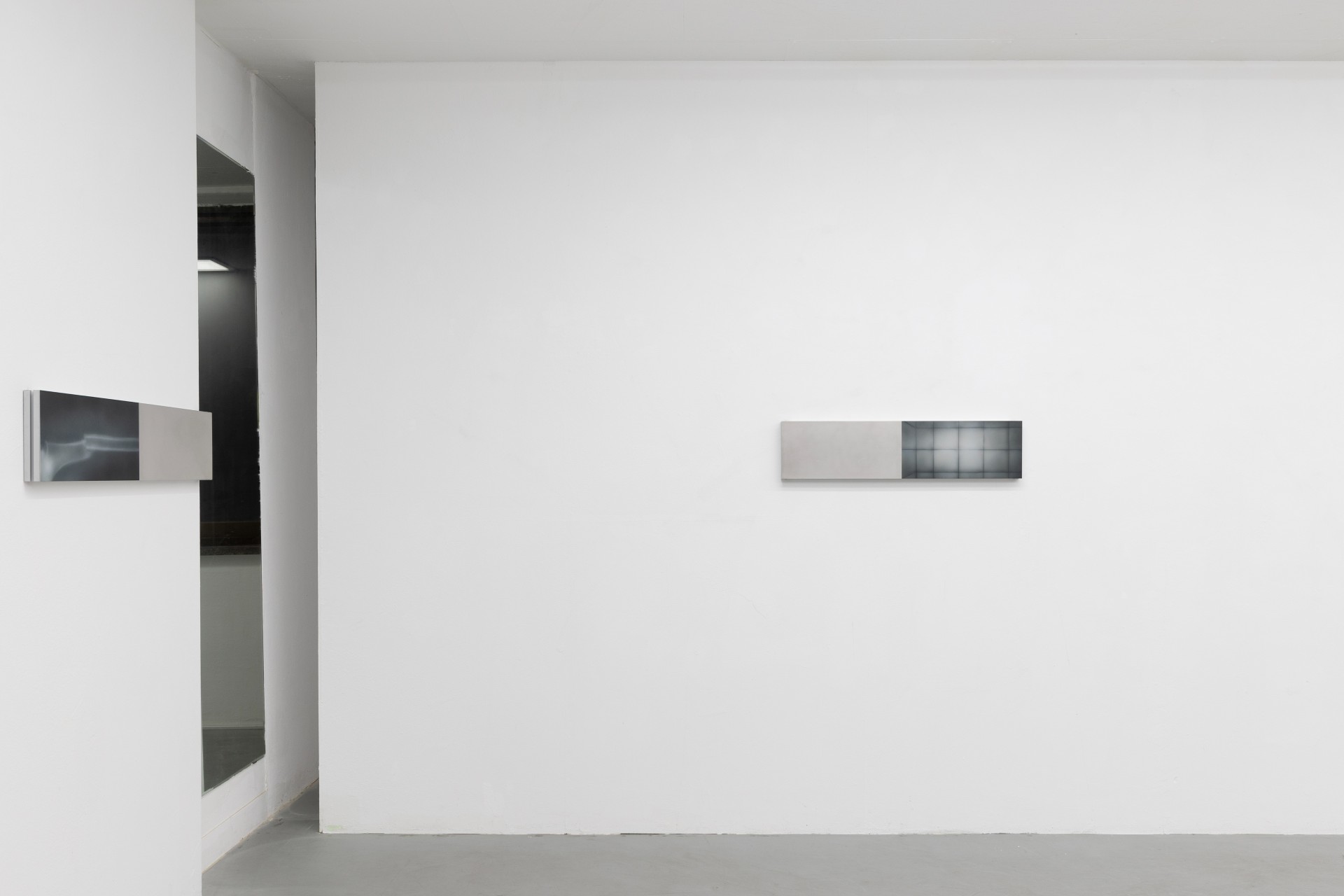 Offline Body by Myungchan Kim at dive.seoul — Two framed works are mounted on the white gallery walls at eye level, positioned asymmetrically across the expansive room.
