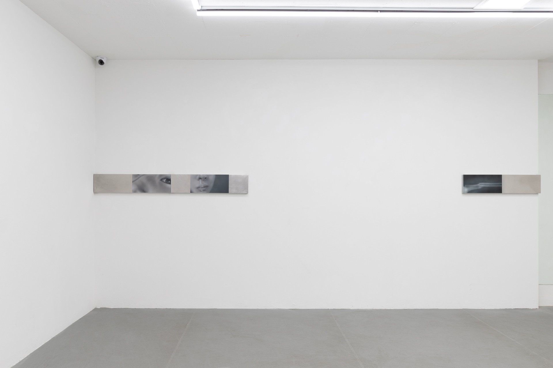 Offline Body by Myungchan Kim at dive.seoul — A minimalist gallery installation featuring two horizontal wall-mounted works positioned at eye level on opposite walls.