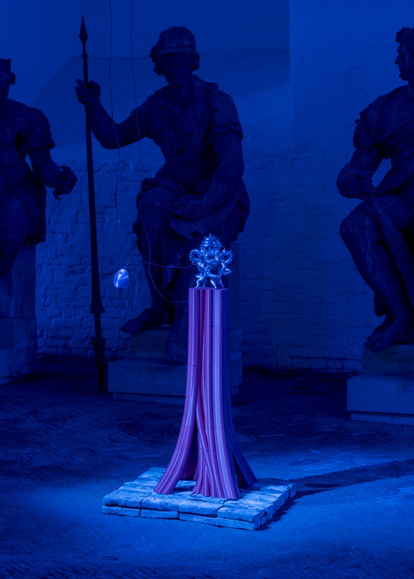 Techno Mythologies by Wang & Söderström at Christian IV’s Brewery — A sculptural installation by Wang & Söderström presents a glowing neon-lit botanical form—a textured cactus with bright blue flowering bloom—elevated on a...
