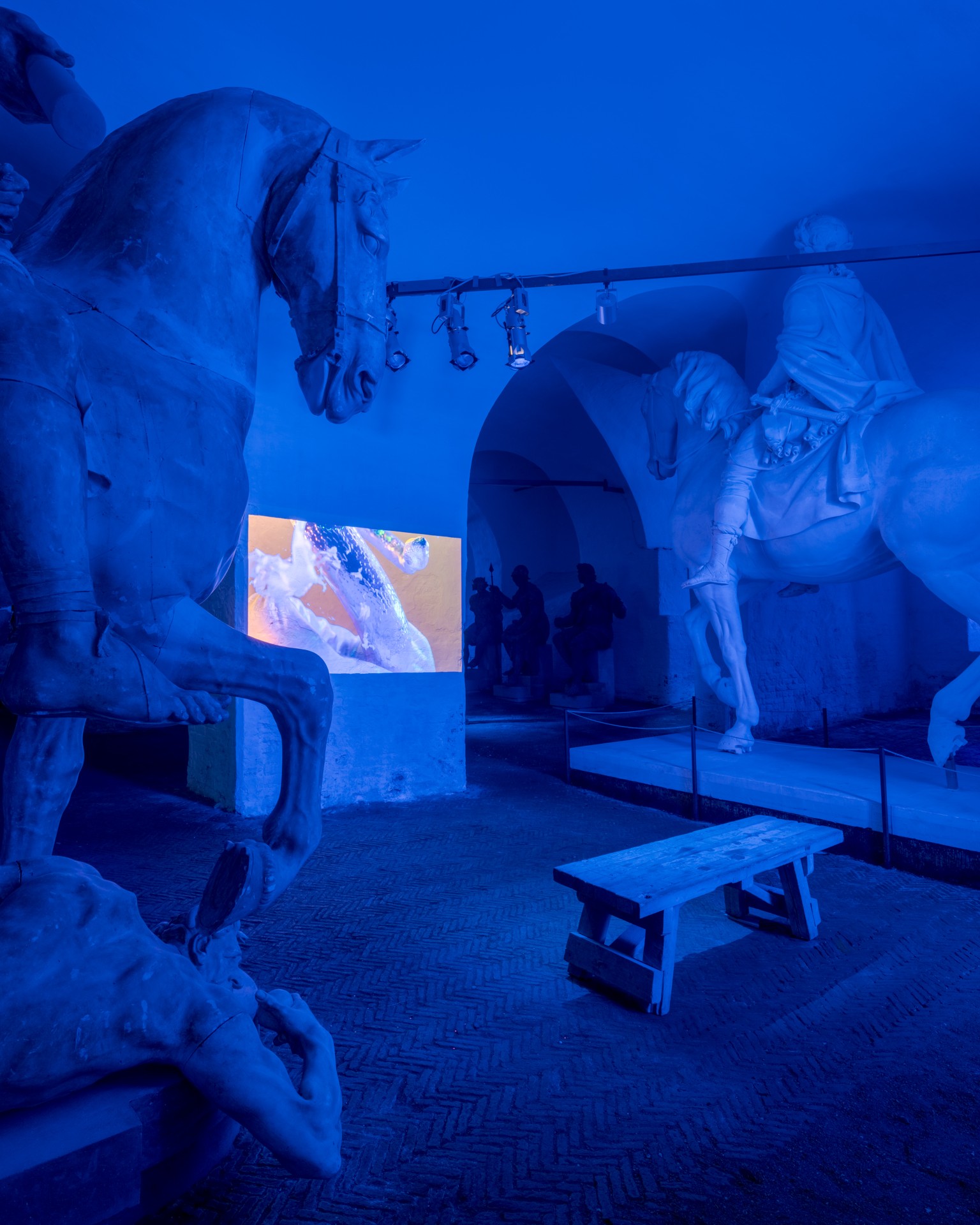 Techno Mythologies by Wang & Söderström at Christian IV’s Brewery — Wang & Söderström's immersive installation bathes classical plaster casts in monochromatic blue lighting, creating stark volumetric shadows across the...