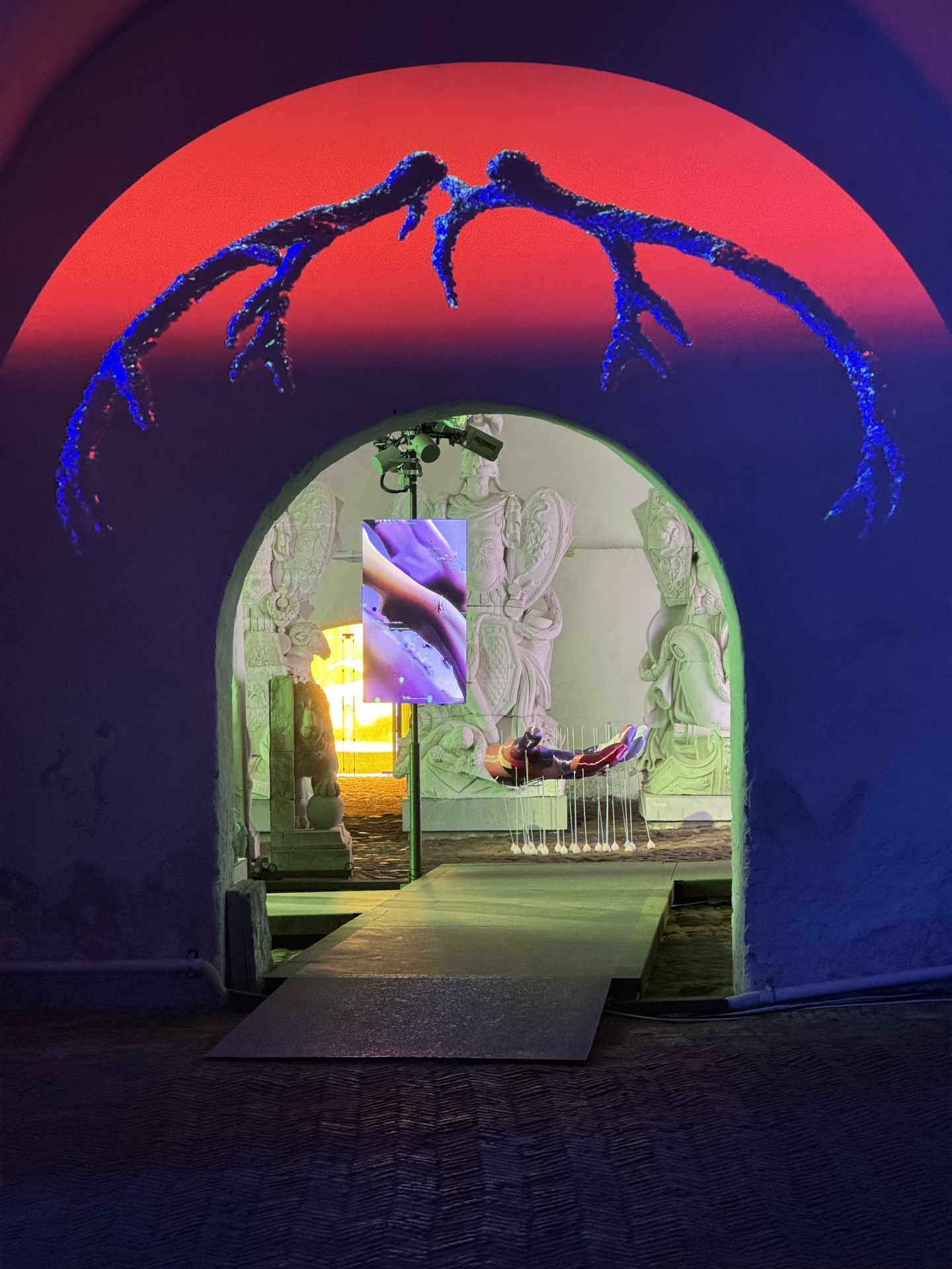 Techno Mythologies by Wang & Söderström at Christian IV’s Brewery — A vaulted archway frames a lime-green gallery interior where classical plaster reliefs line the walls in desaturated tones.