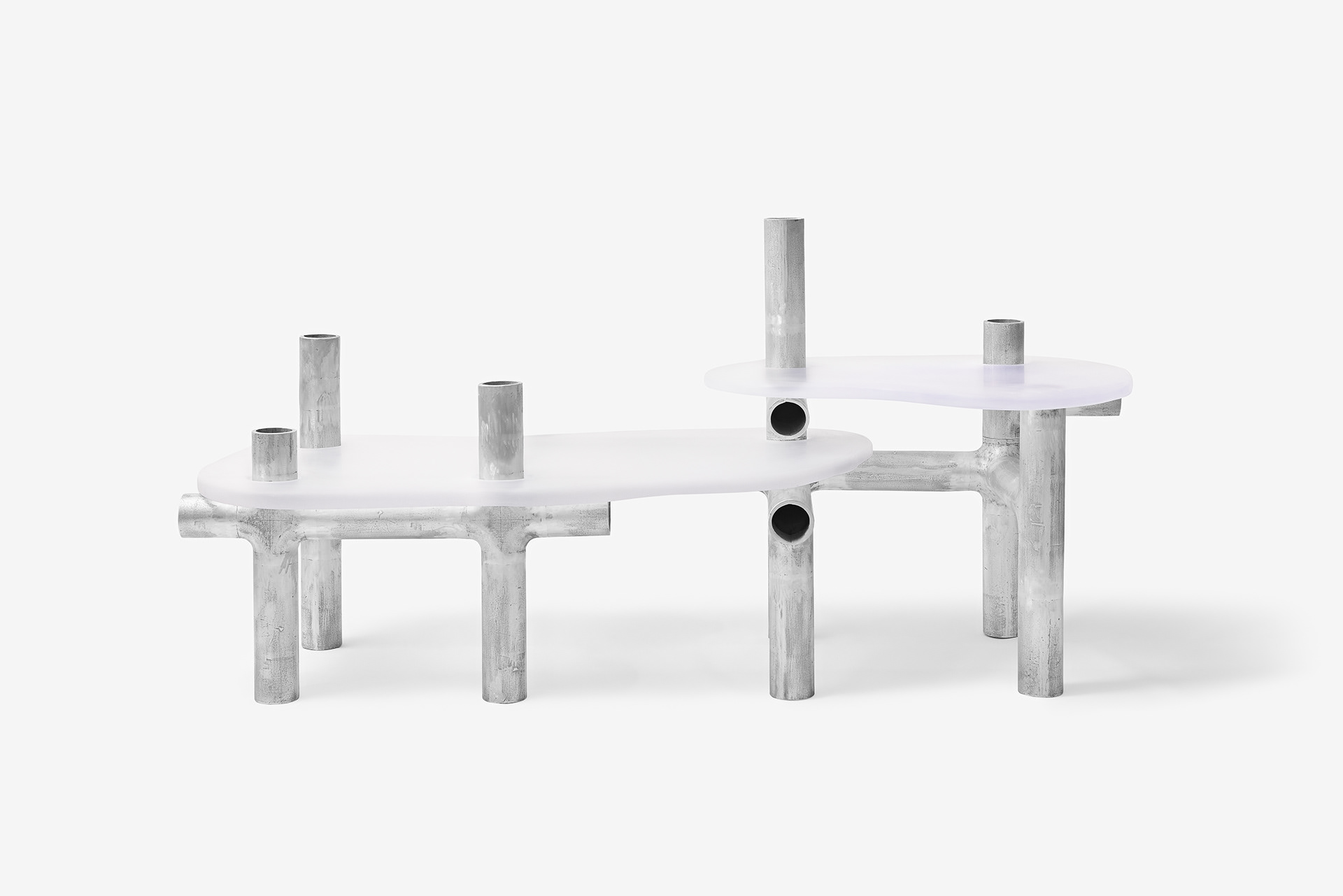 Cylinder Series by Jeonghwa Seo — The Cylinder Series table demonstrates material contrast through frosted white acrylic and weathered aluminum.