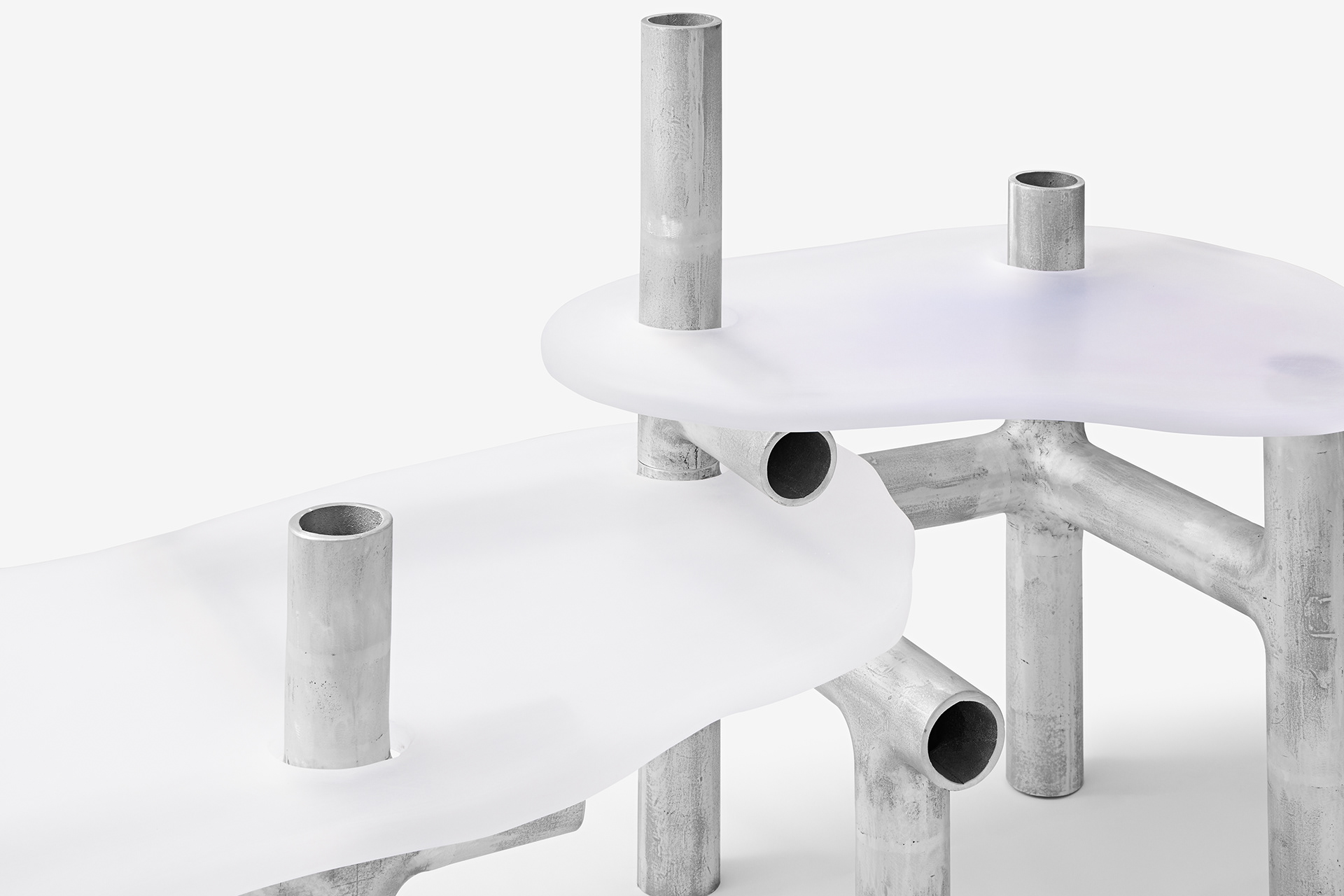 Cylinder Series by Jeonghwa Seo — Cylinder Series table by Jeonghwa Seo featuring a frosted white acrylic circular top mounted on a tripod base of weathered aluminum tubes.