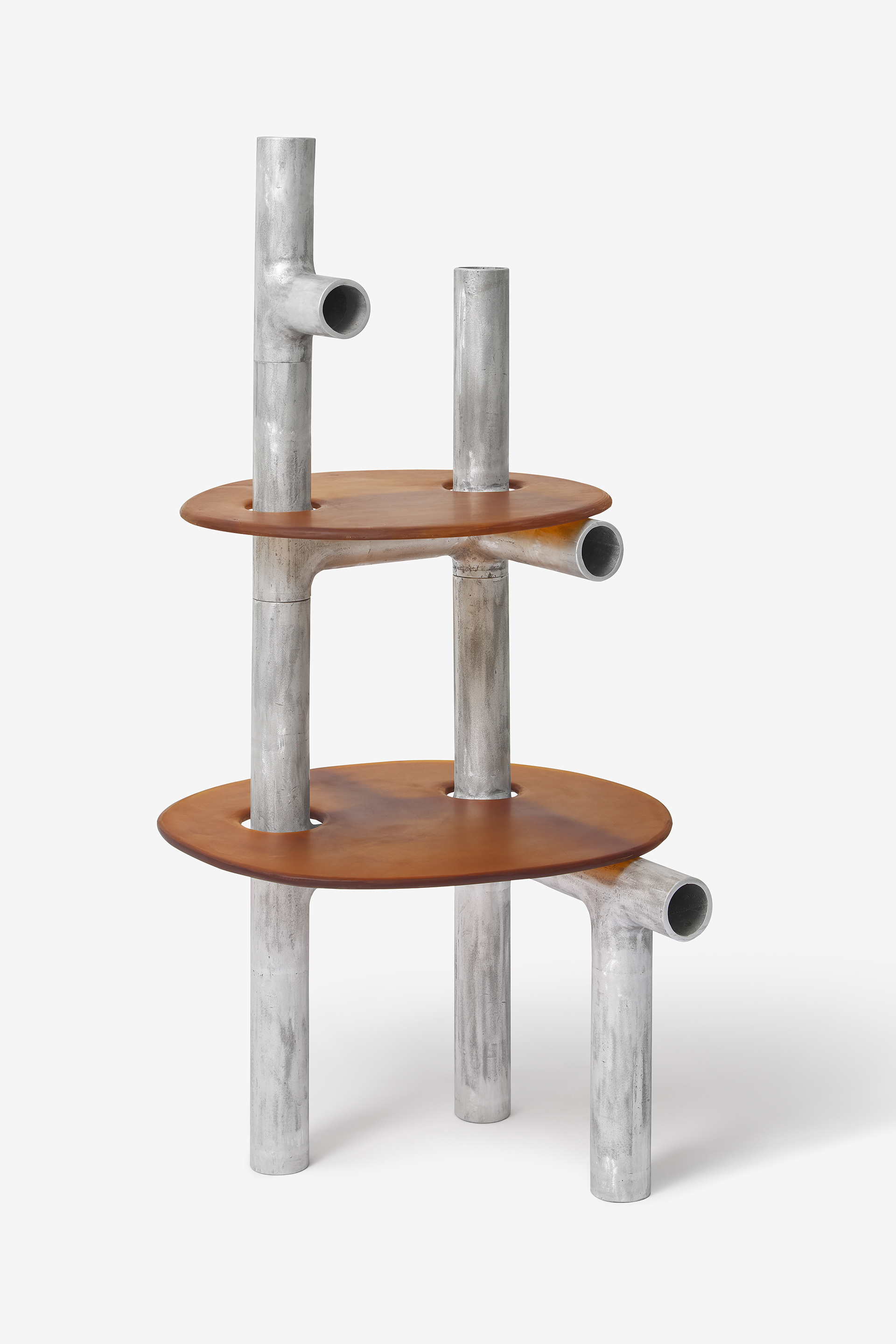 Cylinder Series by Jeonghwa Seo — A tiered table structure from Seo's Cylinder Series featuring two circular wooden tabletops in warm cognac-brown tones, supported by a tripod base of...