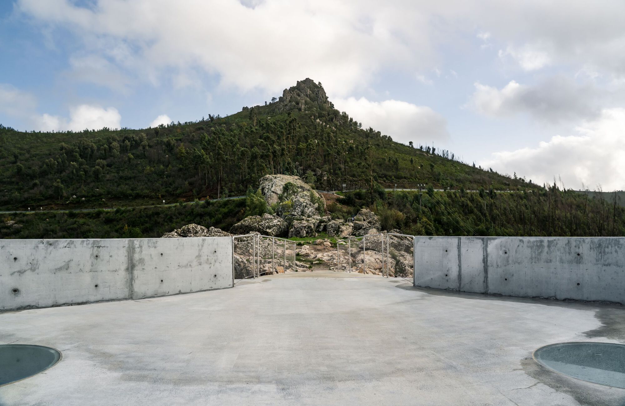 Renovation of the Zebro Viewpoint by Álvaro Siza Vieira by Alvaro Siza — Álvaro Siza Vieira's Zebro Viewpoint presents a monolithic circular platform of exposed reinforced concrete, positioned above a rocky stone base and...