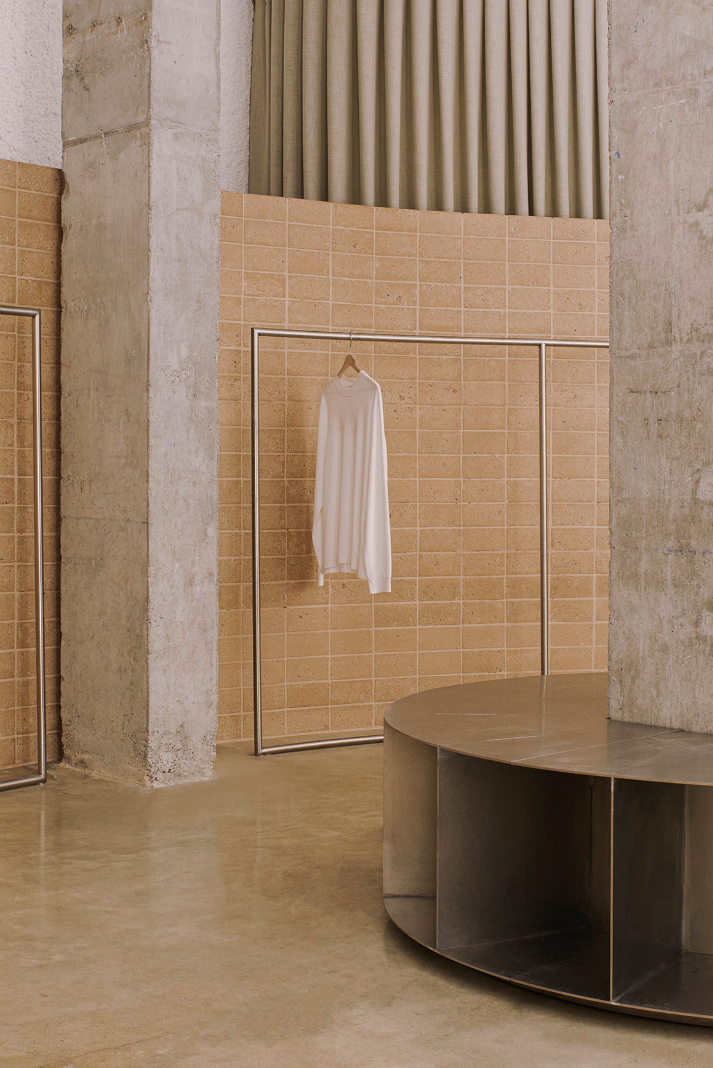 Neutrale by estudio DIIR — A retail interior articulates design through restrained material composition.