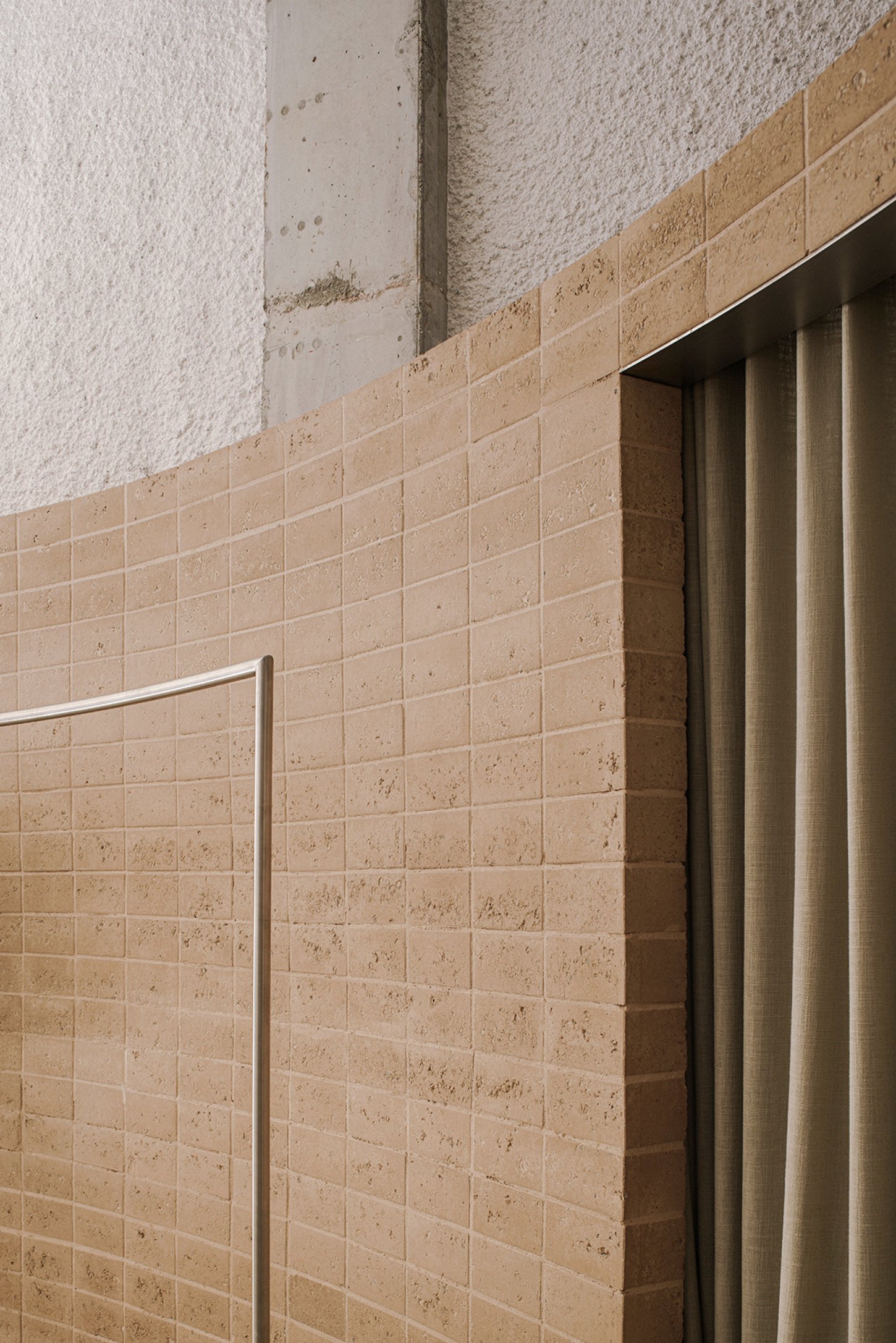 Neutrale by estudio DIIR — Detail of Neutrale's retail interior revealing the material vocabulary at the threshold between display and customer space.