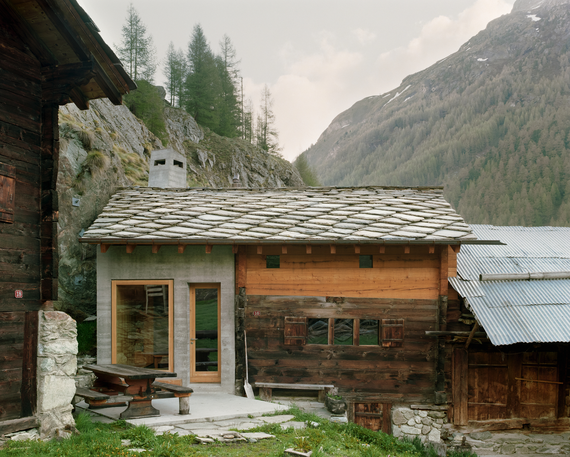 Lù Chatarme Transformation by Deschenaux Follonier by Deschenaux Architectes — A renovated alpine chalet in Evolène reveals the architect's intervention through contrasting materiality.