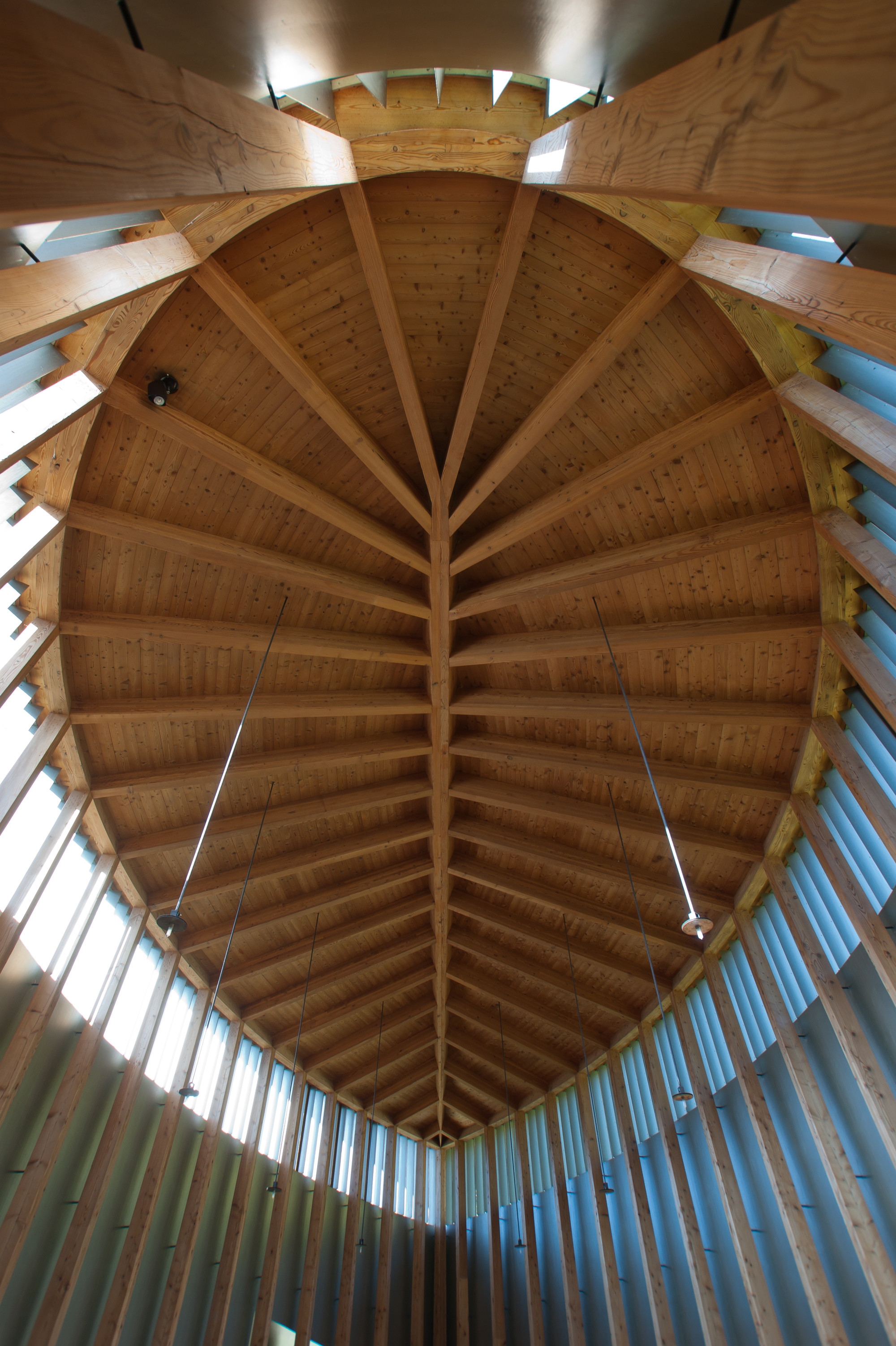 Saint Benedict Chapel by Peter Zumthor — Interior view looking upward through the chapel's timber-framed ceiling, revealing the radial structural system characteristic of Zumthor's design.