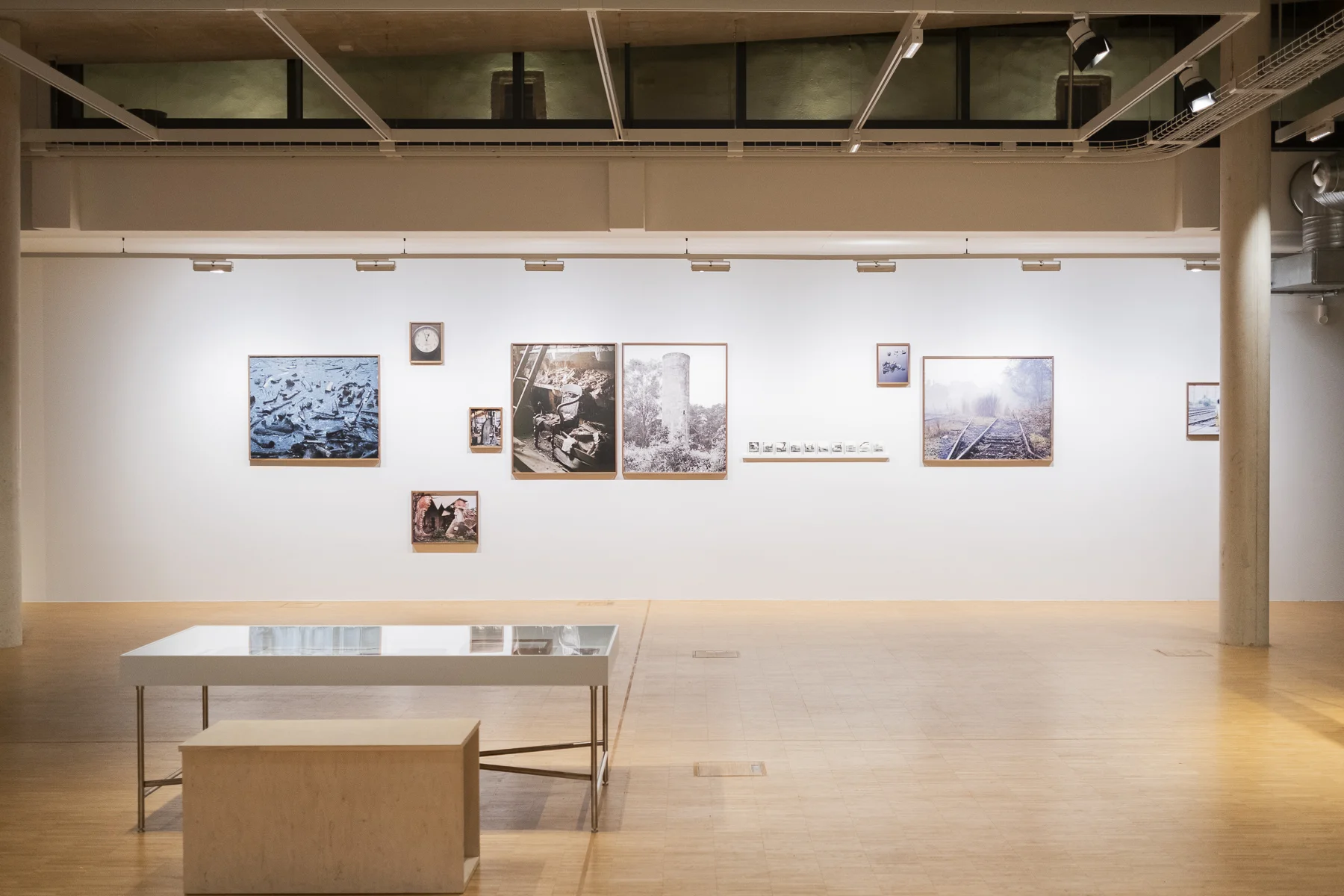 Leen / Jirno / Awngar by Sarker Protick, photographed by Sarker Protick — A solitary figure in red traverses a vast, barren landscape of stone and mineral extraction.