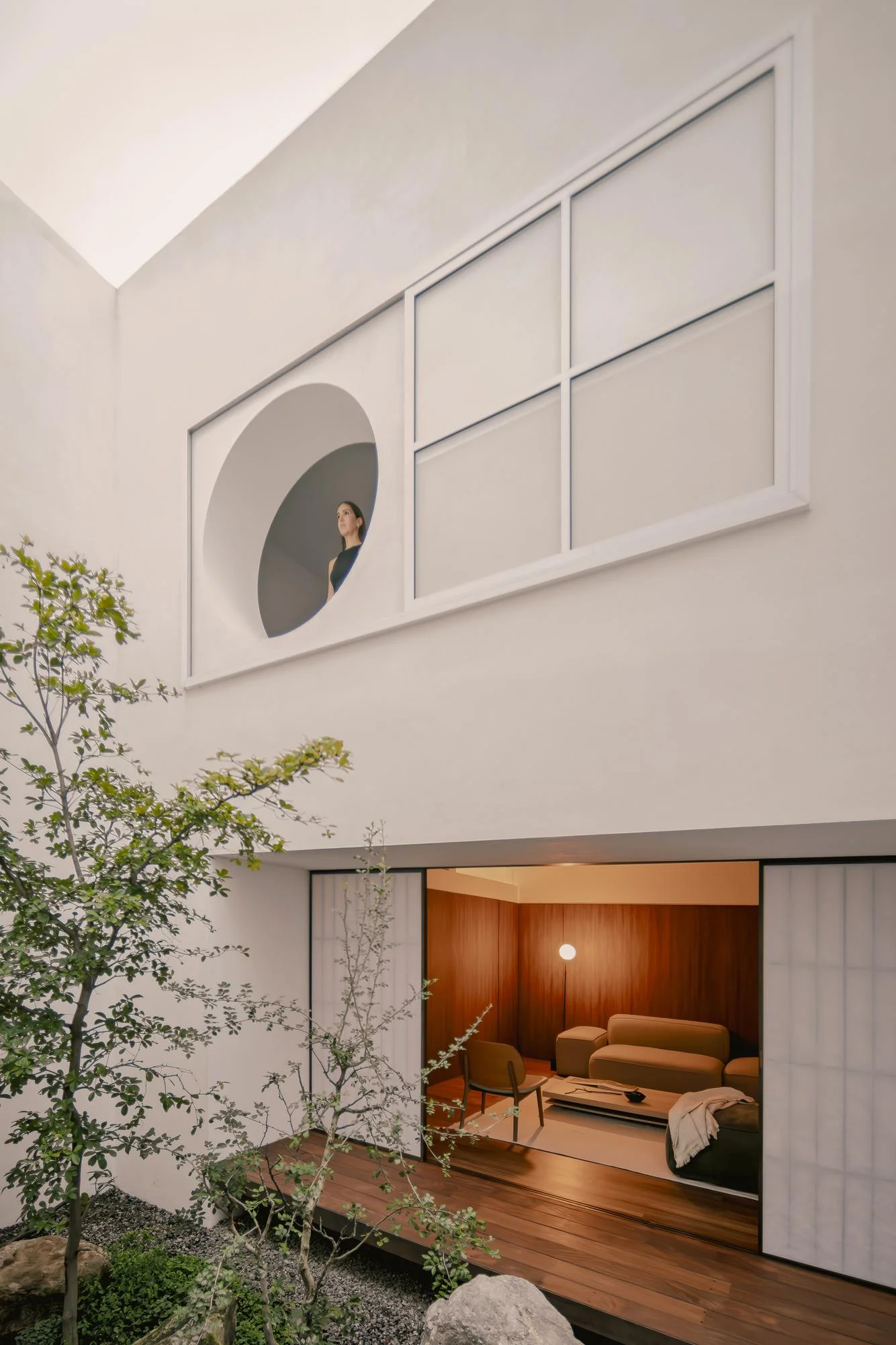 Kehai House by HW Studio, photographed by César Béjar, Gustavo Quiroz — View into Kehai House showing the central void as architectural organizing principle.