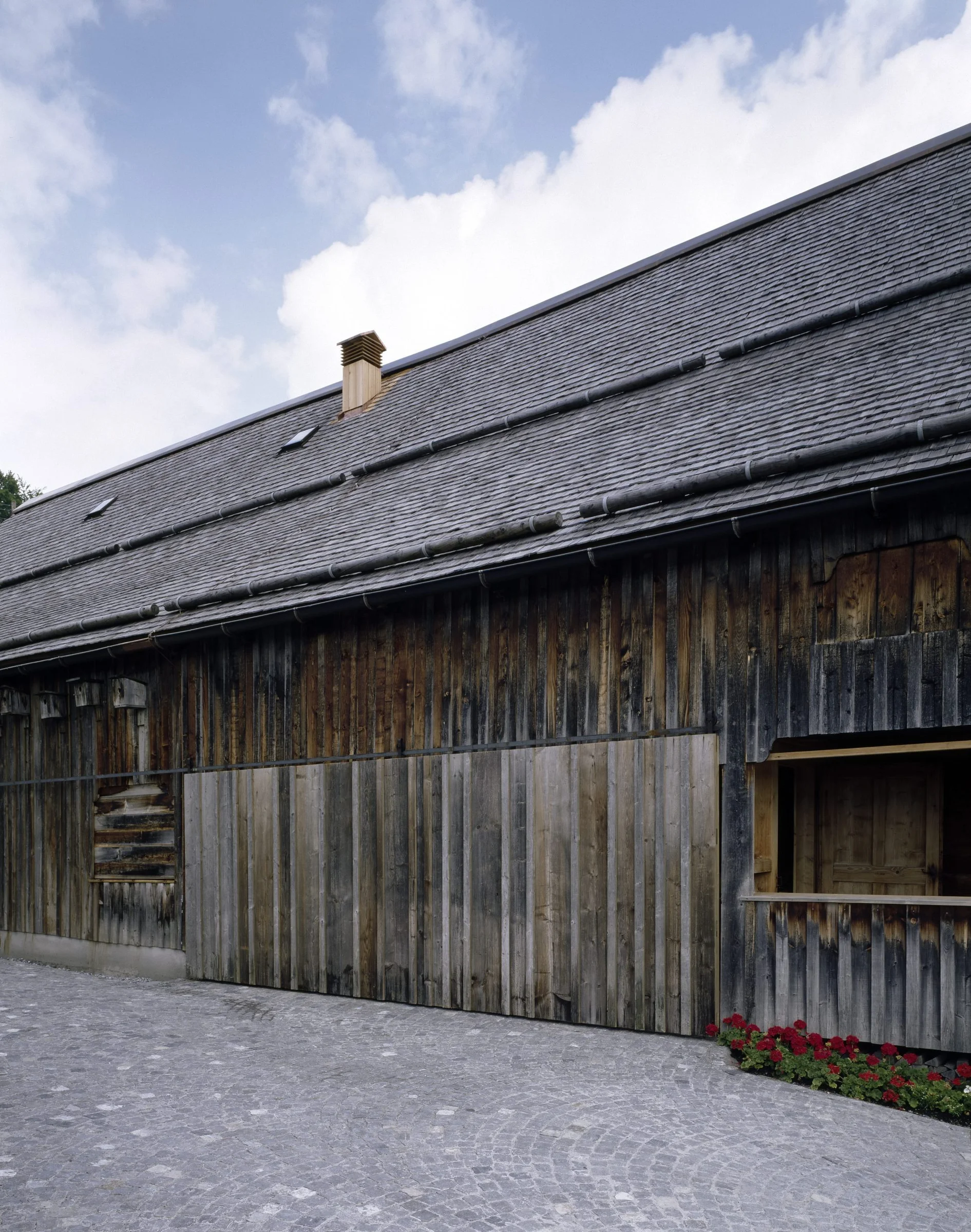 The Angelika Kauffmann Museum by Dietrich Untertrifaller, photographed by Bruno Klomfar — A gallery interior displaying Old Master paintings within a converted 16th-century farmhouse.